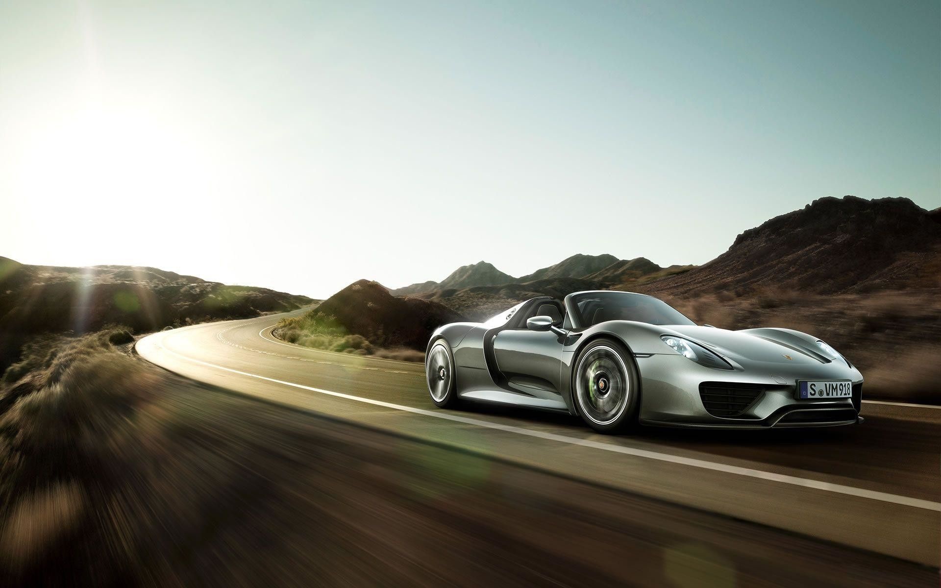 Porsche 918 Spyder, Winding mountain highway, Sun flare over hills, HD Desktop wallpaper