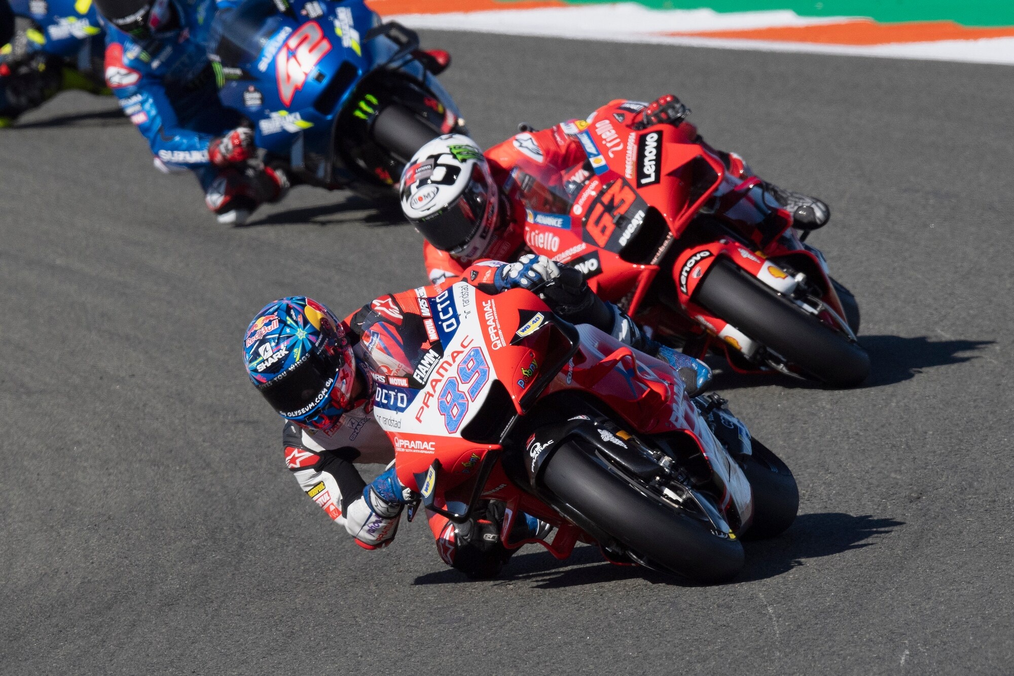 Jorge Martin number 89, Francesco Bagnaia number 63, Alex Rins number 42, Pramac Ducati red livery, MotoGP three-bike battle, HD Desktop wallpaper