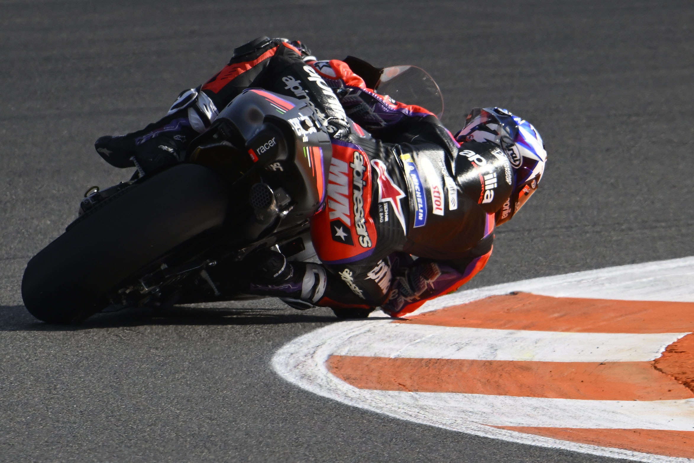 Maverick Vinales Aprilia RS-GP, Black and red leathers, MotoGP elbow down apex, HD Desktop wallpaper