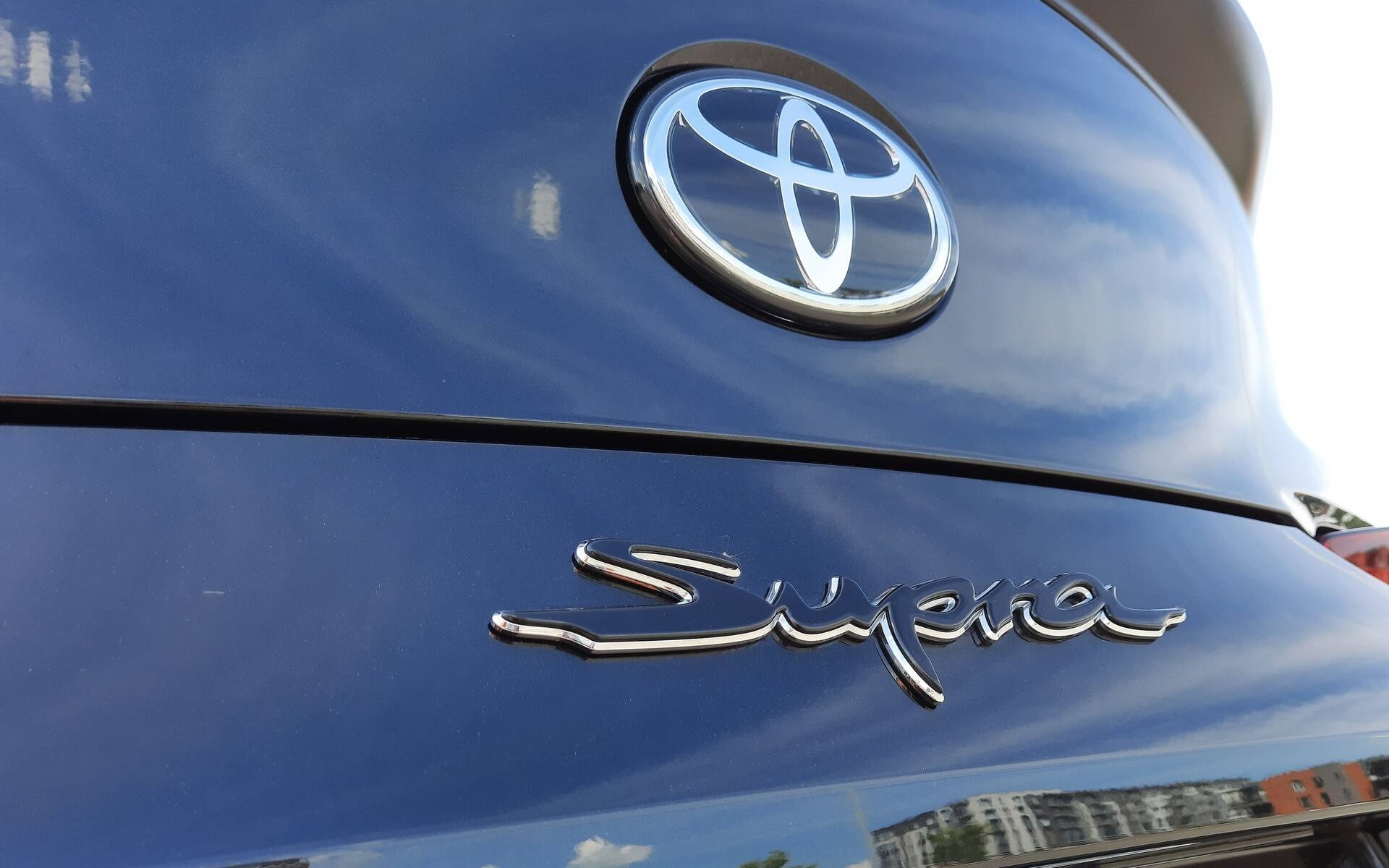 Toyota Supra badge, Chrome Toyota emblem, Metallic blue car body, HD Desktop wallpaper