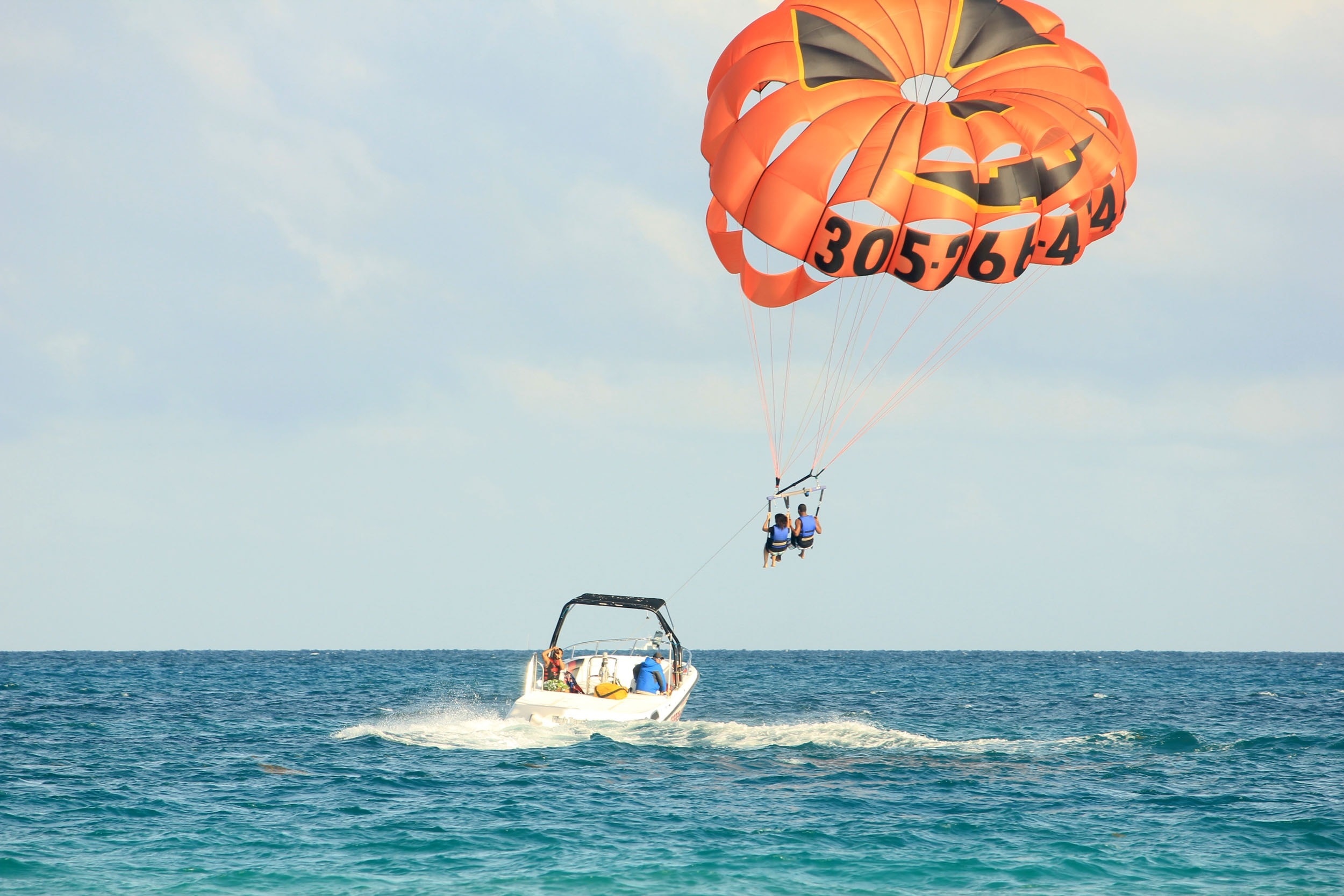 Cloudy skies parasailing, Tandem thrill, Adventure in the air, Free stock image, 2500x1670 HD Desktop