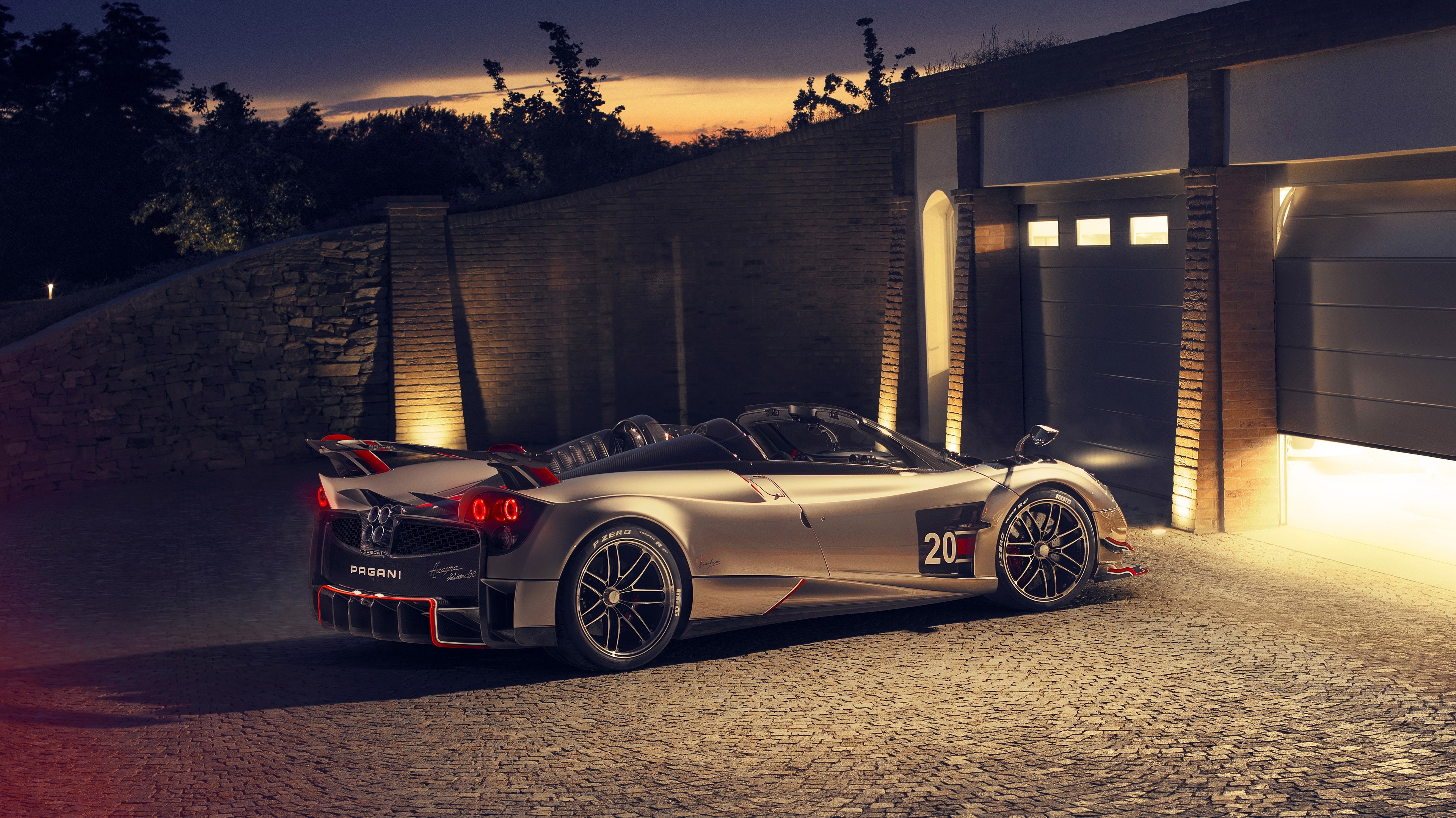 Pagani Huayra Roadster BC, Cobblestone garage driveway, Illuminated brick garage, 4K Desktop wallpaper