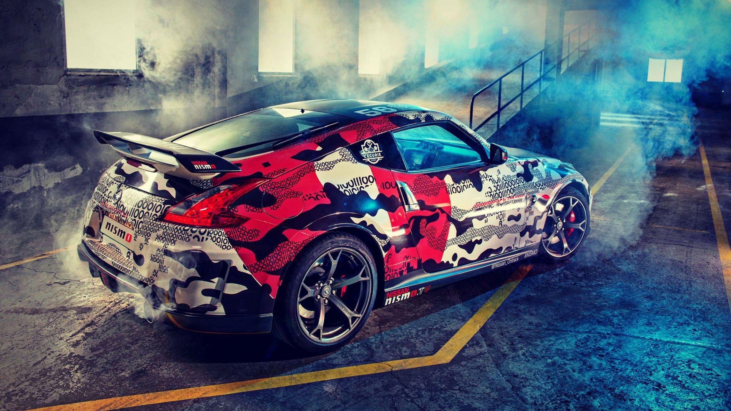 Nissan 370Z Nismo, digital camouflage livery, industrial warehouse burnout smoke, HD Desktop wallpaper