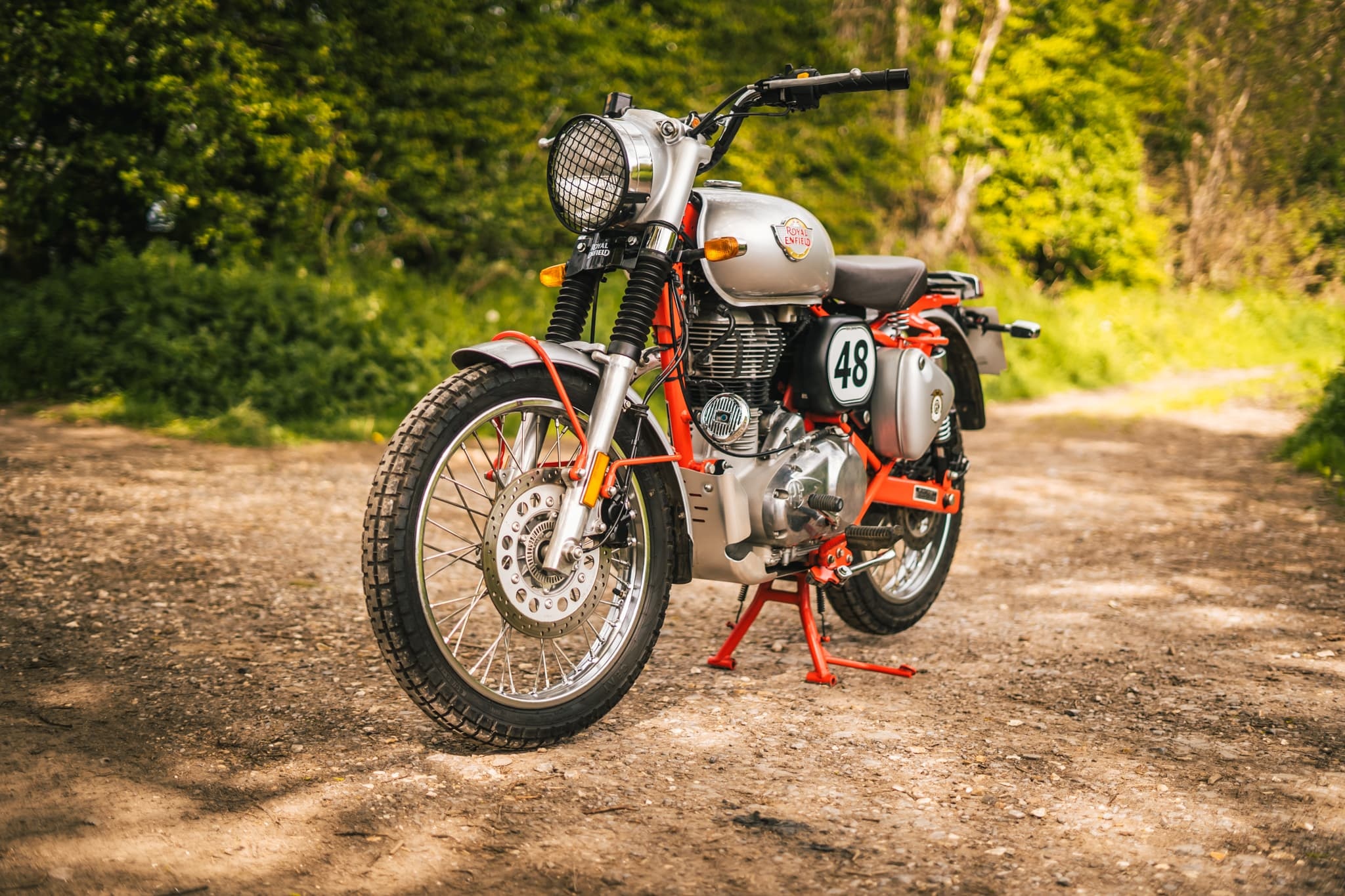Royal Enfield Bullet Trials 500, mesh headlight grille, sunlit dirt trail, HD Desktop wallpaper
