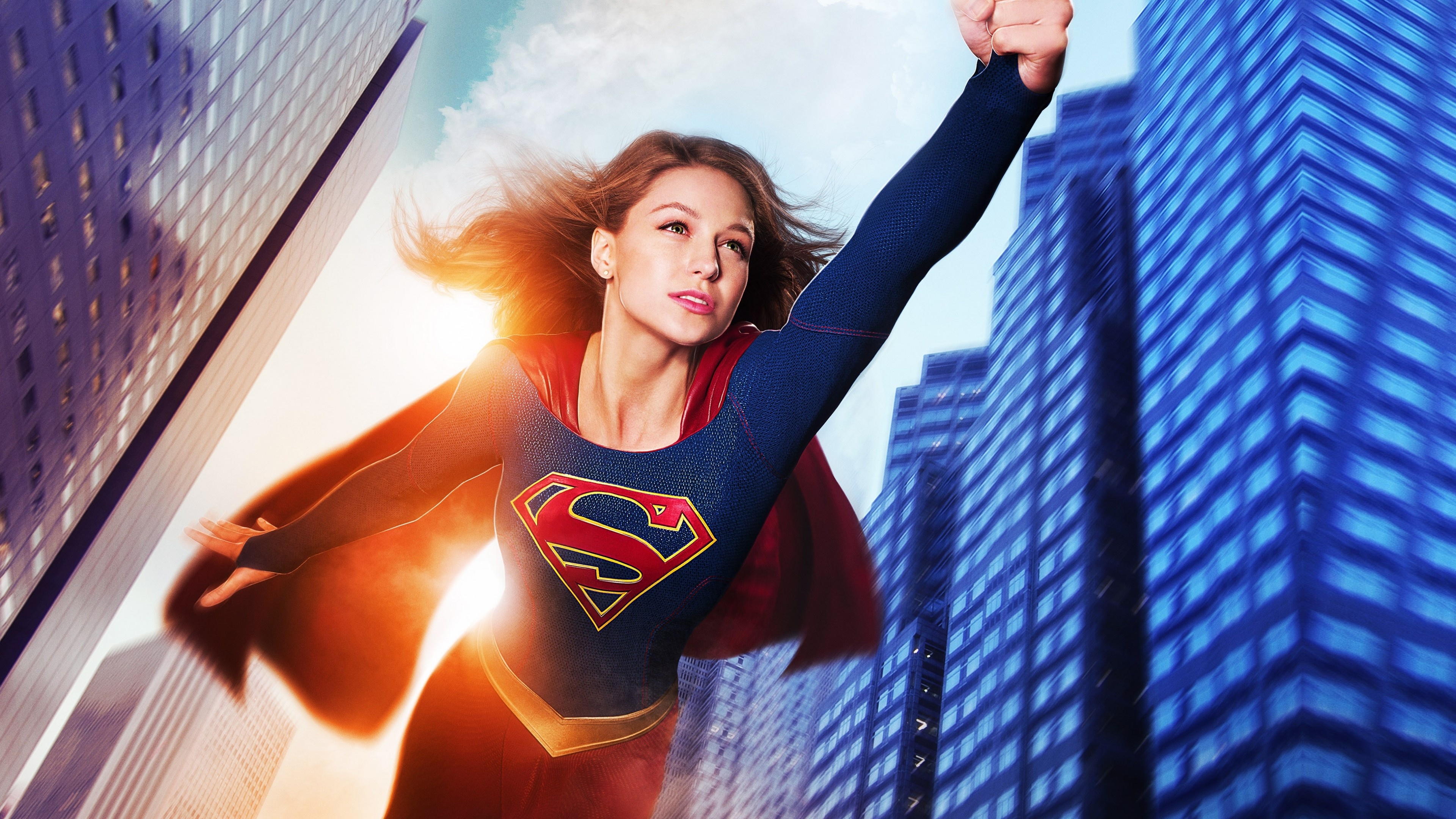 Melissa Benoist as Supergirl, House of El insignia, National City skyscrapers, 4K Desktop wallpaper