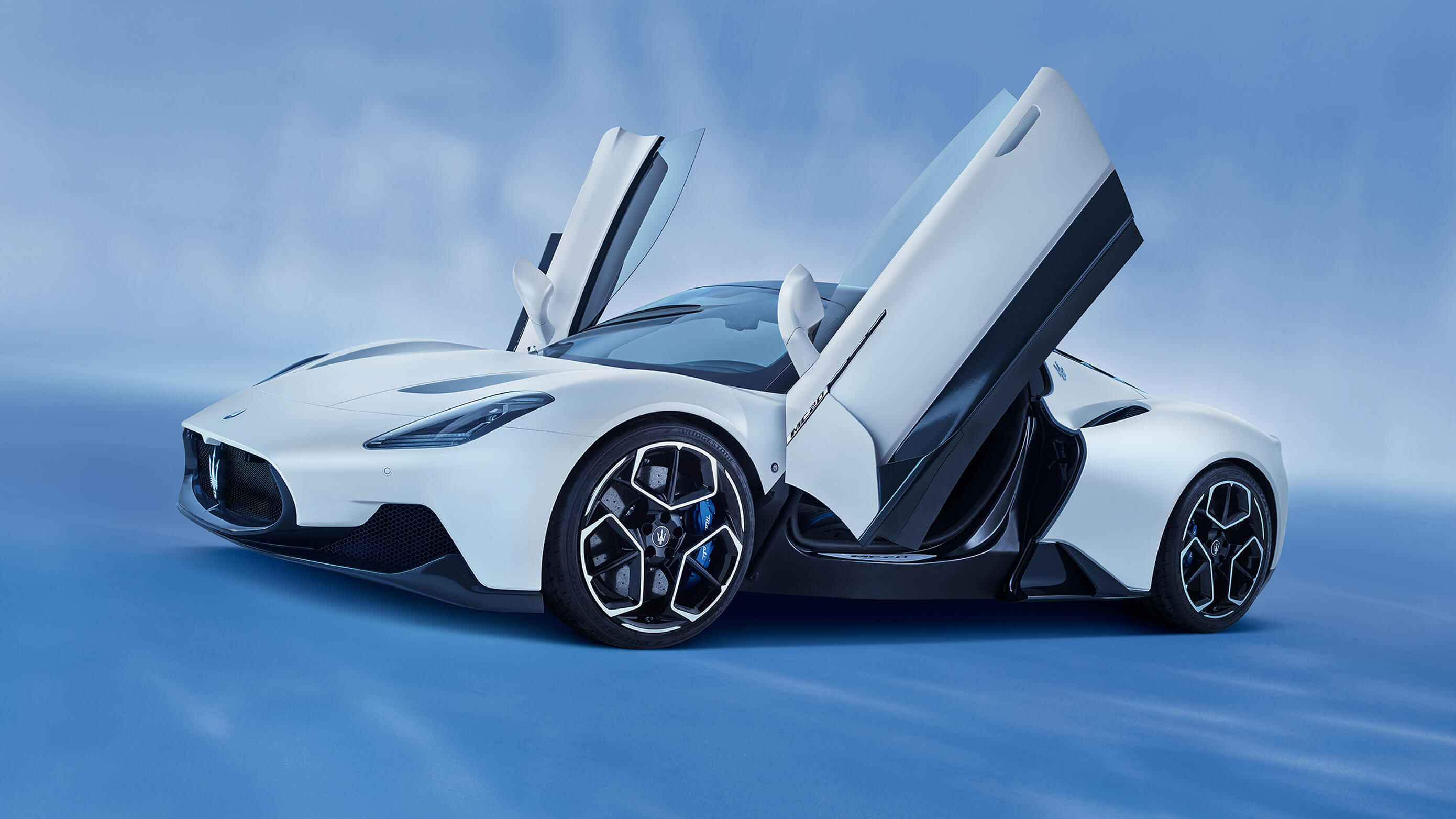 Maserati MC20, open butterfly doors, blue studio setting, HD Desktop wallpaper