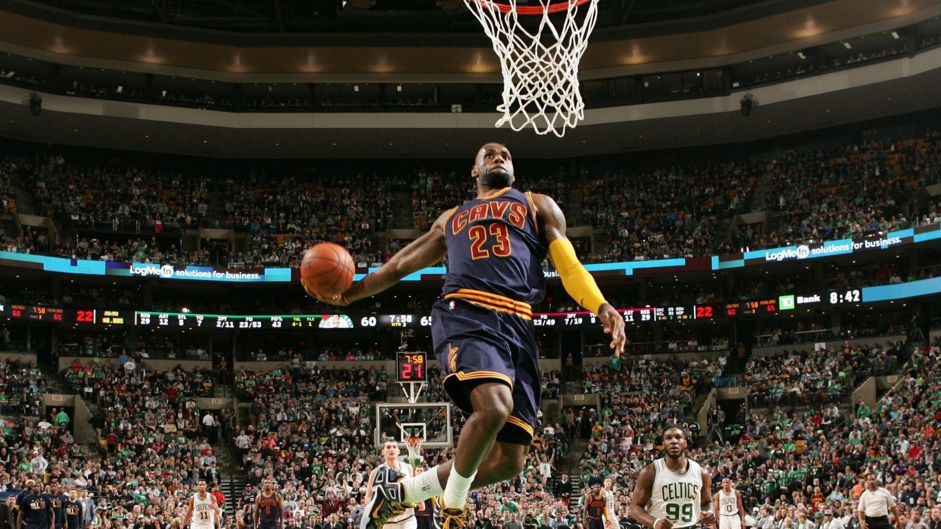 LeBron James mid-air dunk, Cleveland Cavaliers uniform, Boston Celtics arena crowd, Full HD Desktop wallpaper