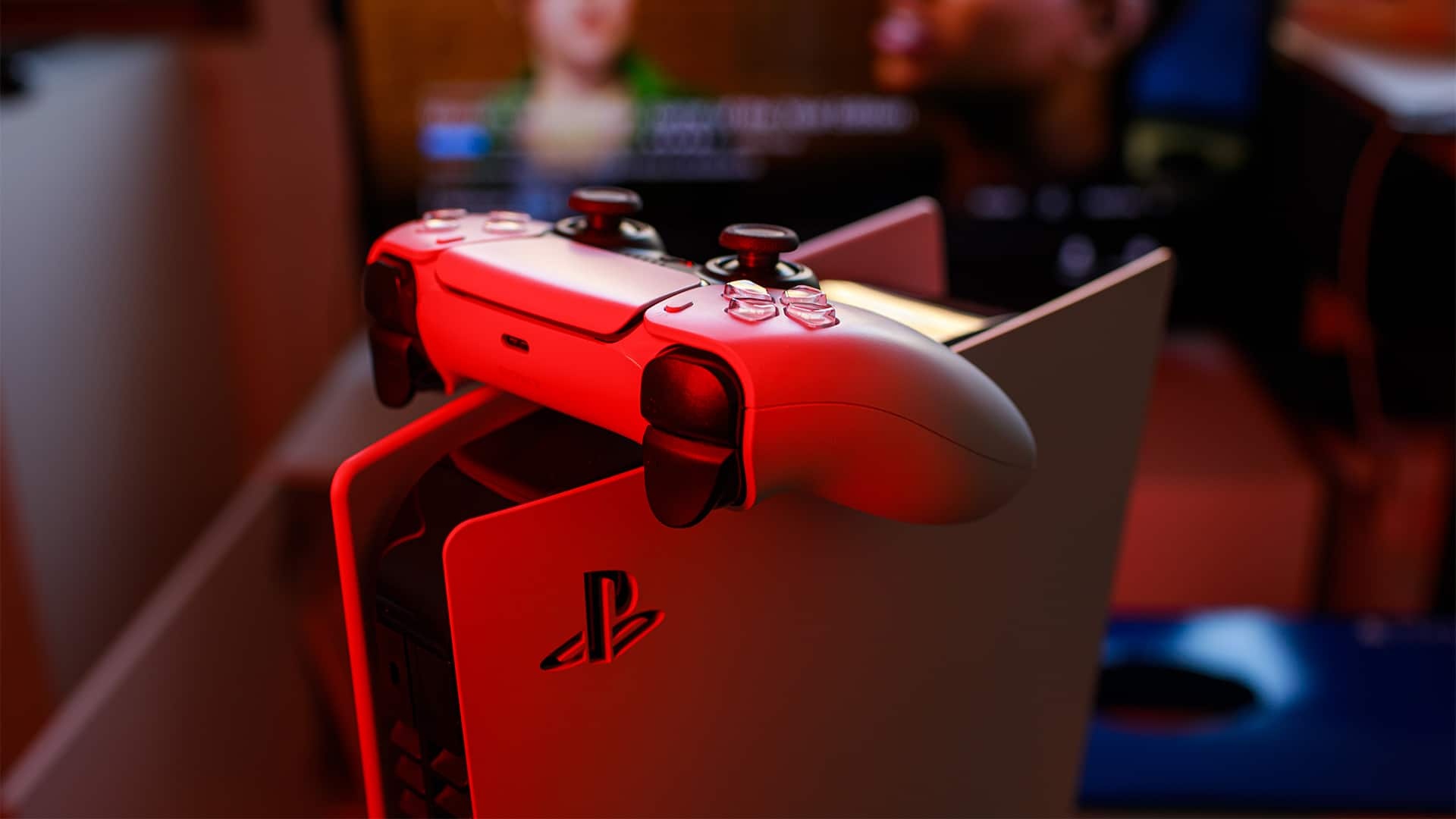 DualSense wireless controller, PlayStation 5 console, Red ambient room lighting, Full HD Desktop wallpaper