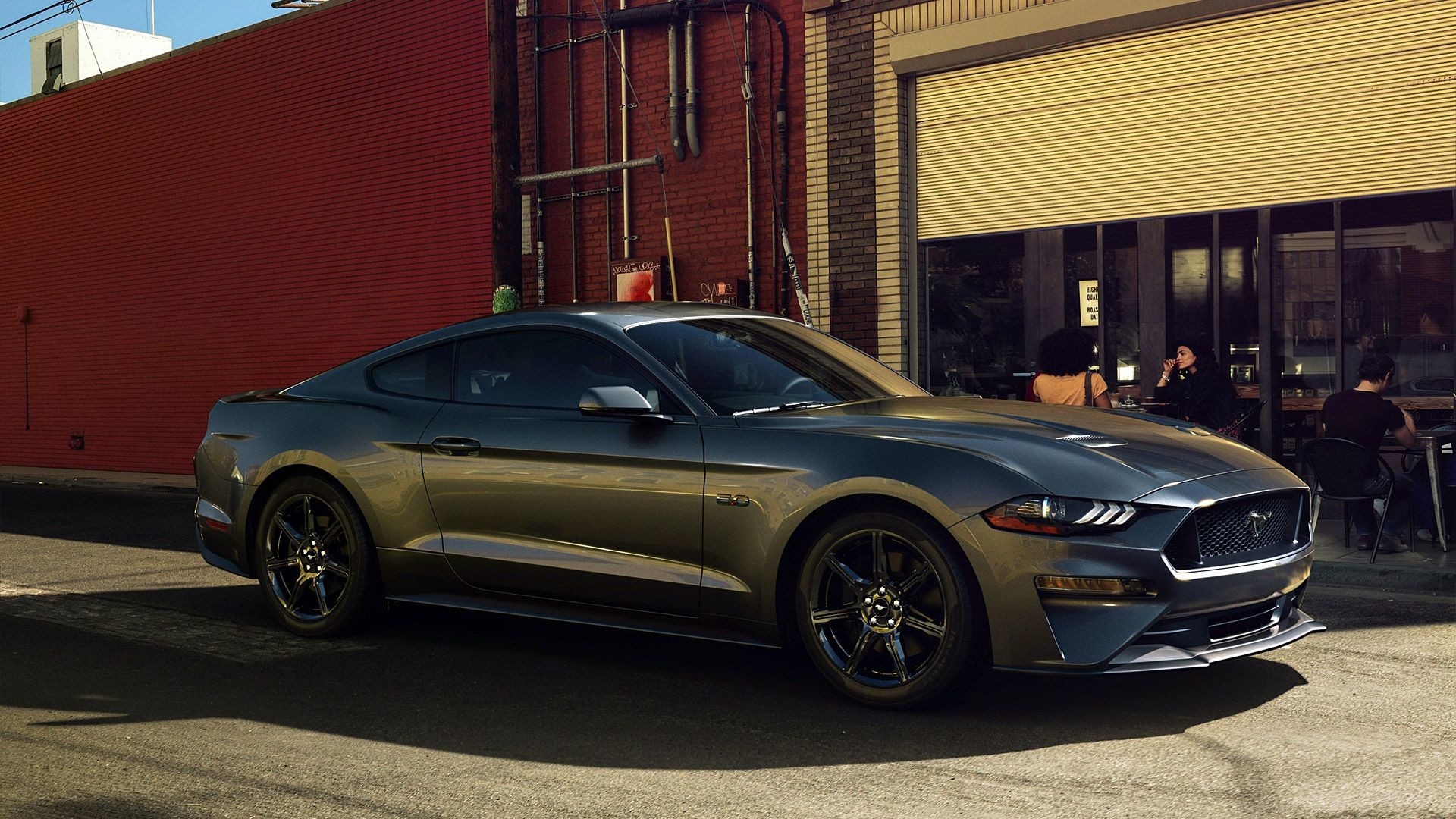 Ford Mustang GT Fastback, Red brick building exterior, Sidewalk cafe patio, Full HD Desktop wallpaper