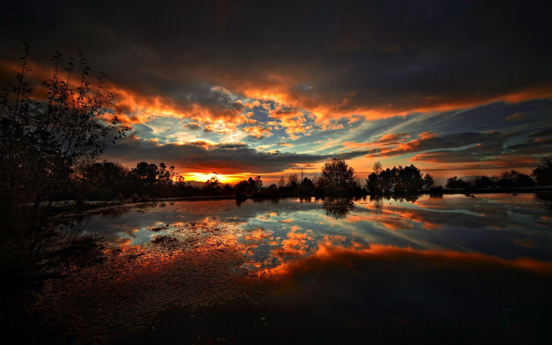 calm lake water reflection, silhouetted shoreline trees, fiery orange dusk clouds, HD Desktop wallpaper