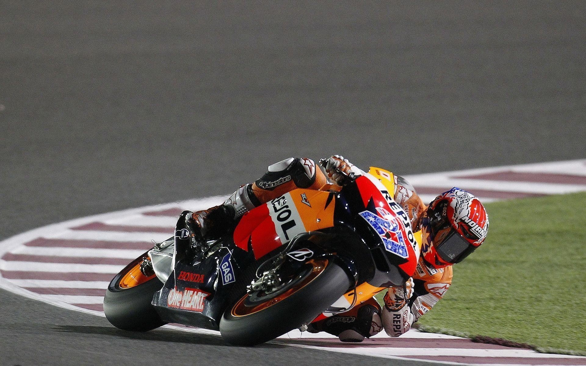 Casey Stoner number 27, Repsol Honda MotoGP bike, Night race under floodlights, HD Desktop wallpaper