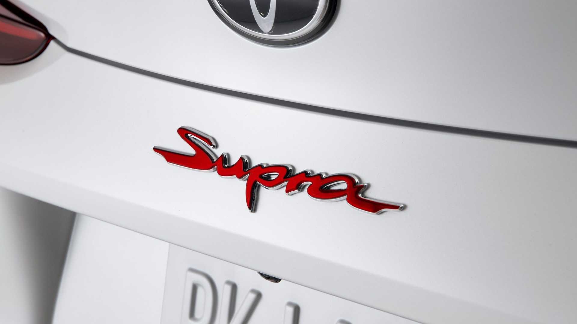 Toyota Supra script emblem, Toyota logo badge, White car rear body, Full HD Desktop wallpaper