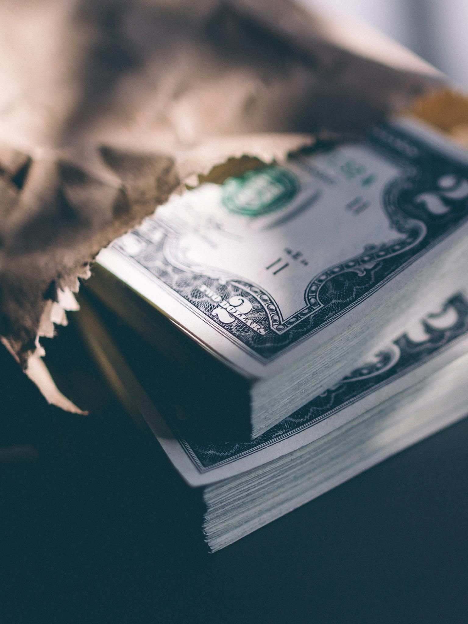United States two-dollar bills, Crinkled brown paper bag, Tightly stacked currency bundle, HD Phone wallpaper