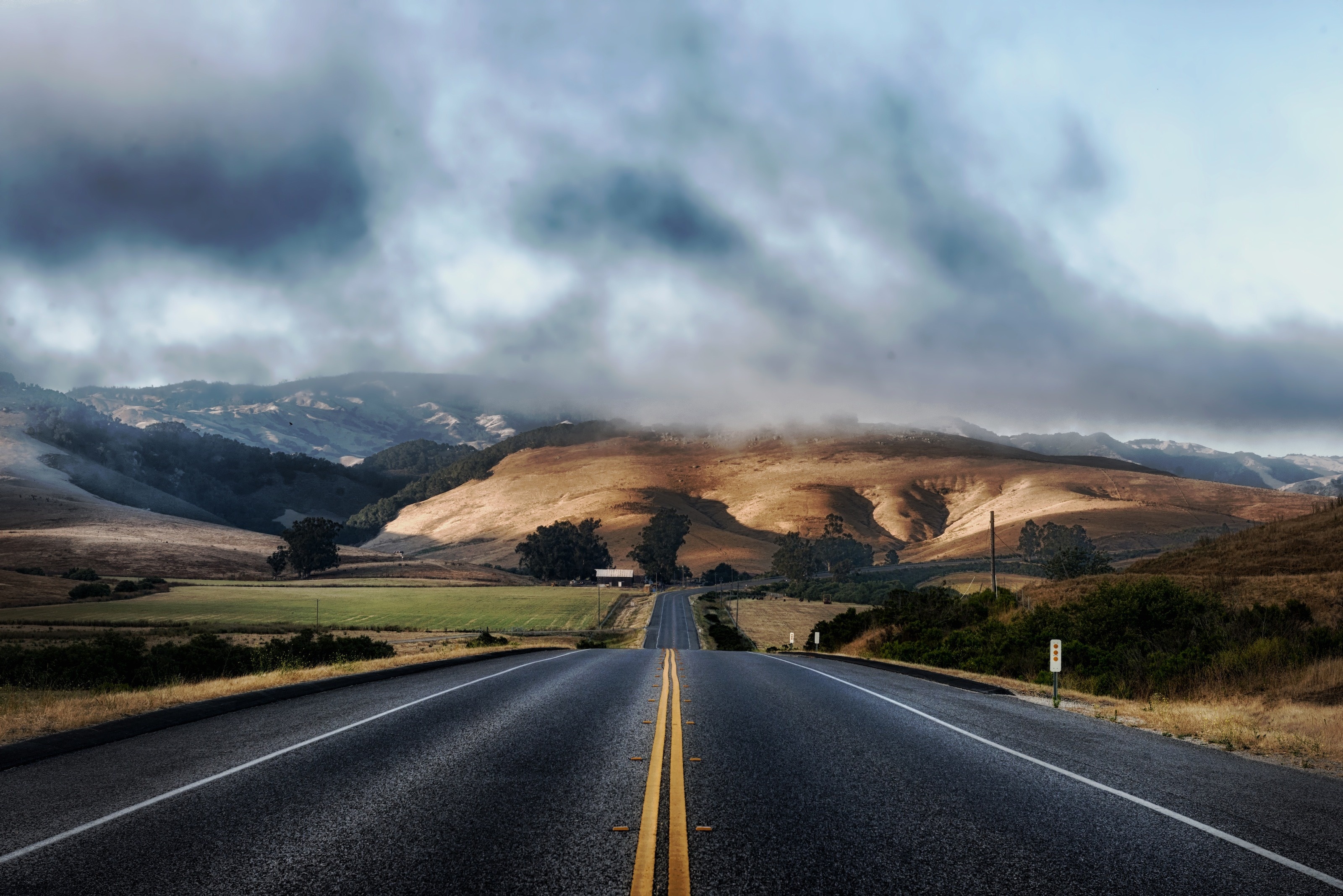 two-lane asphalt highway, rolling golden hills, coastal marine layer clouds, HD Desktop wallpaper