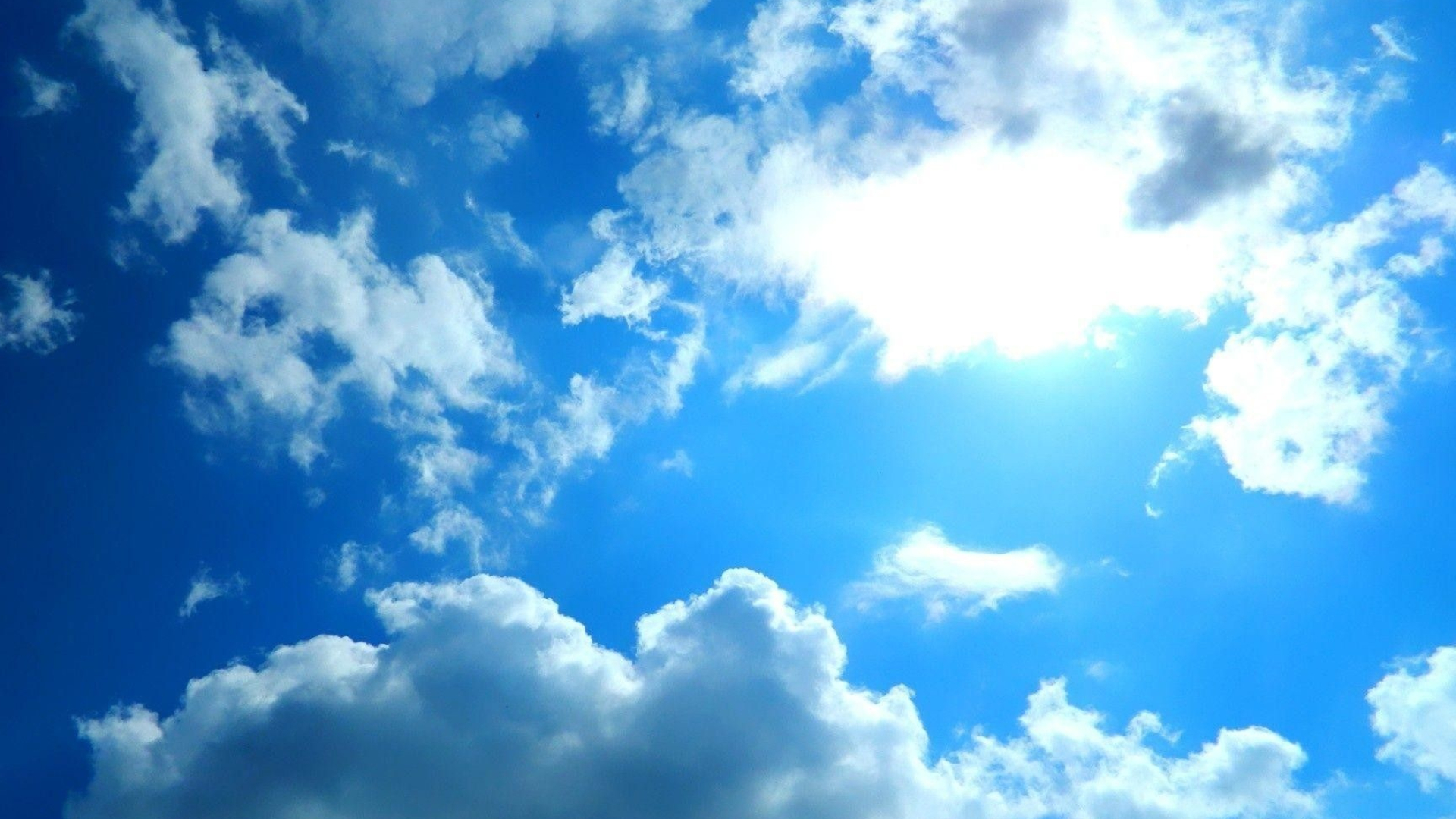 Bright midday sun, White cumulus clouds, Vibrant blue sky, Full HD Desktop wallpaper