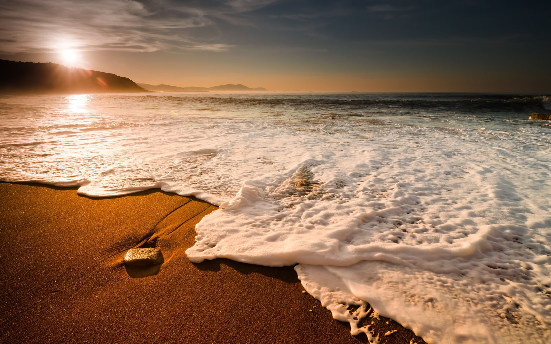 foaming ocean surf, golden hour coastal sunrise, wet sandy shoreline, HD Desktop wallpaper