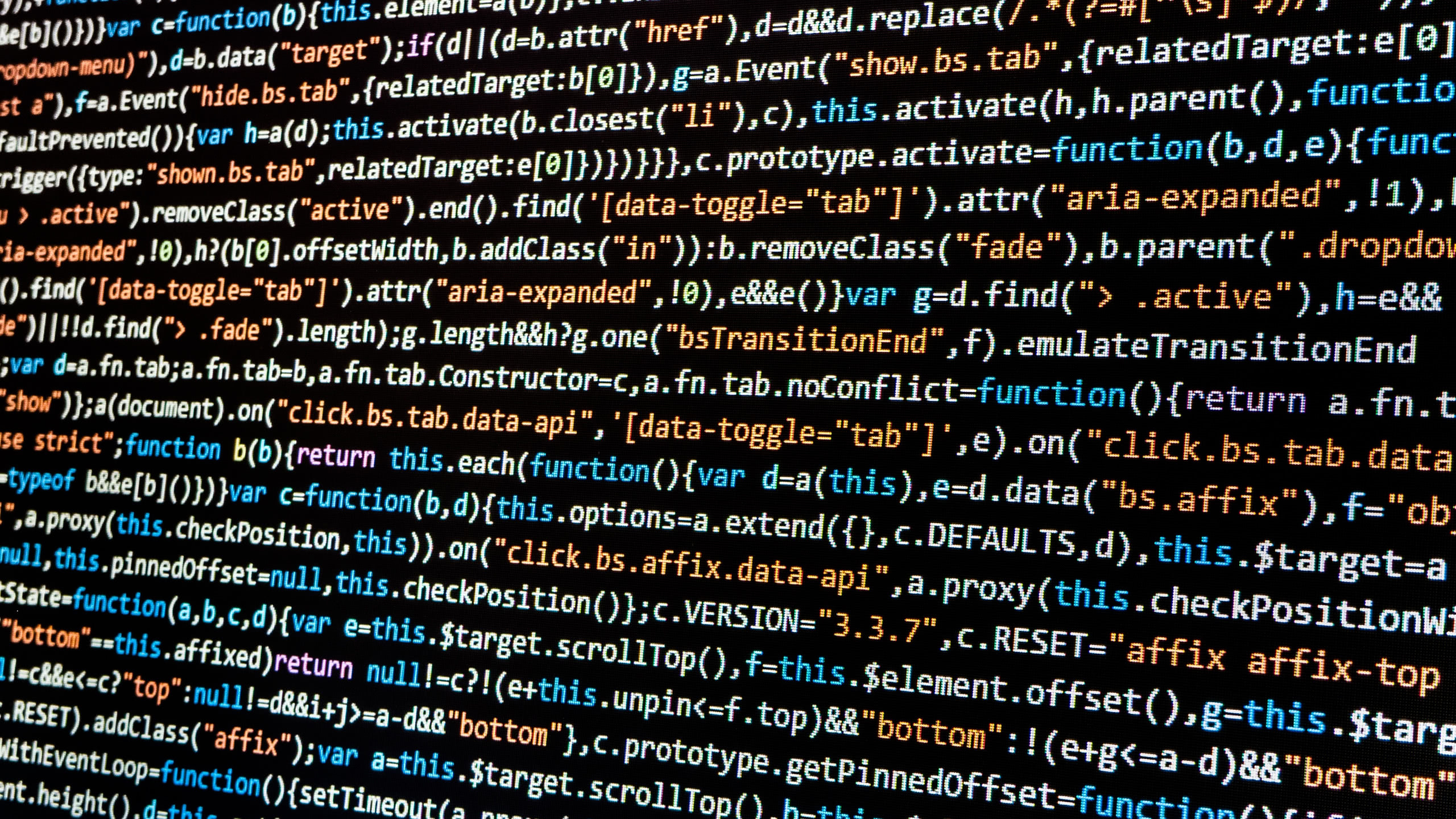 Bootstrap 3.3.7 source code, syntax highlighted JavaScript, macro computer monitor display, HD Desktop wallpaper