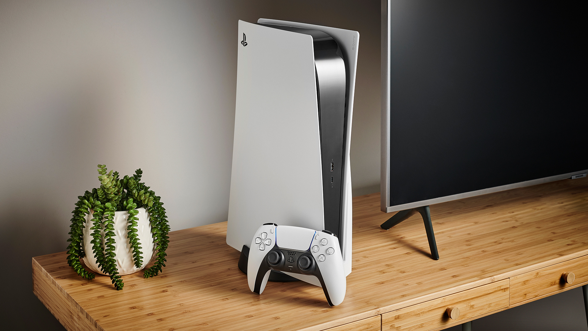 PlayStation 5 console, DualSense wireless controller, Wooden TV cabinet, Potted succulent plant, Full HD Desktop wallpaper