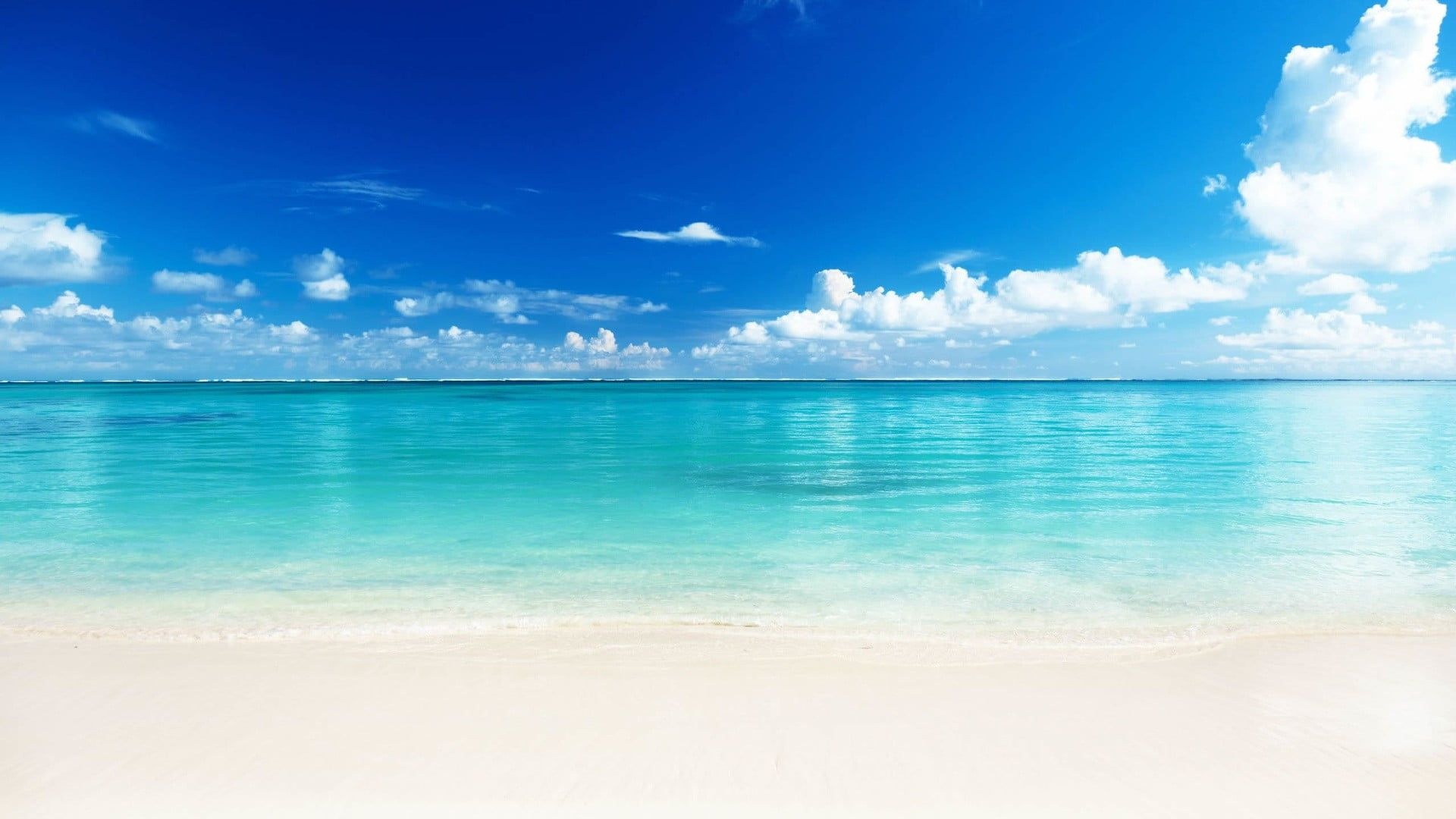 white sand shoreline, calm turquoise ocean, scattered cumulus clouds, Full HD Desktop wallpaper