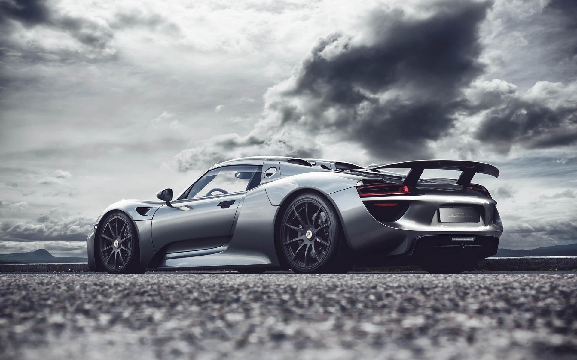 Silver Porsche 918 Spyder, Dramatic storm clouds, Asphalt road surface, HD Desktop wallpaper