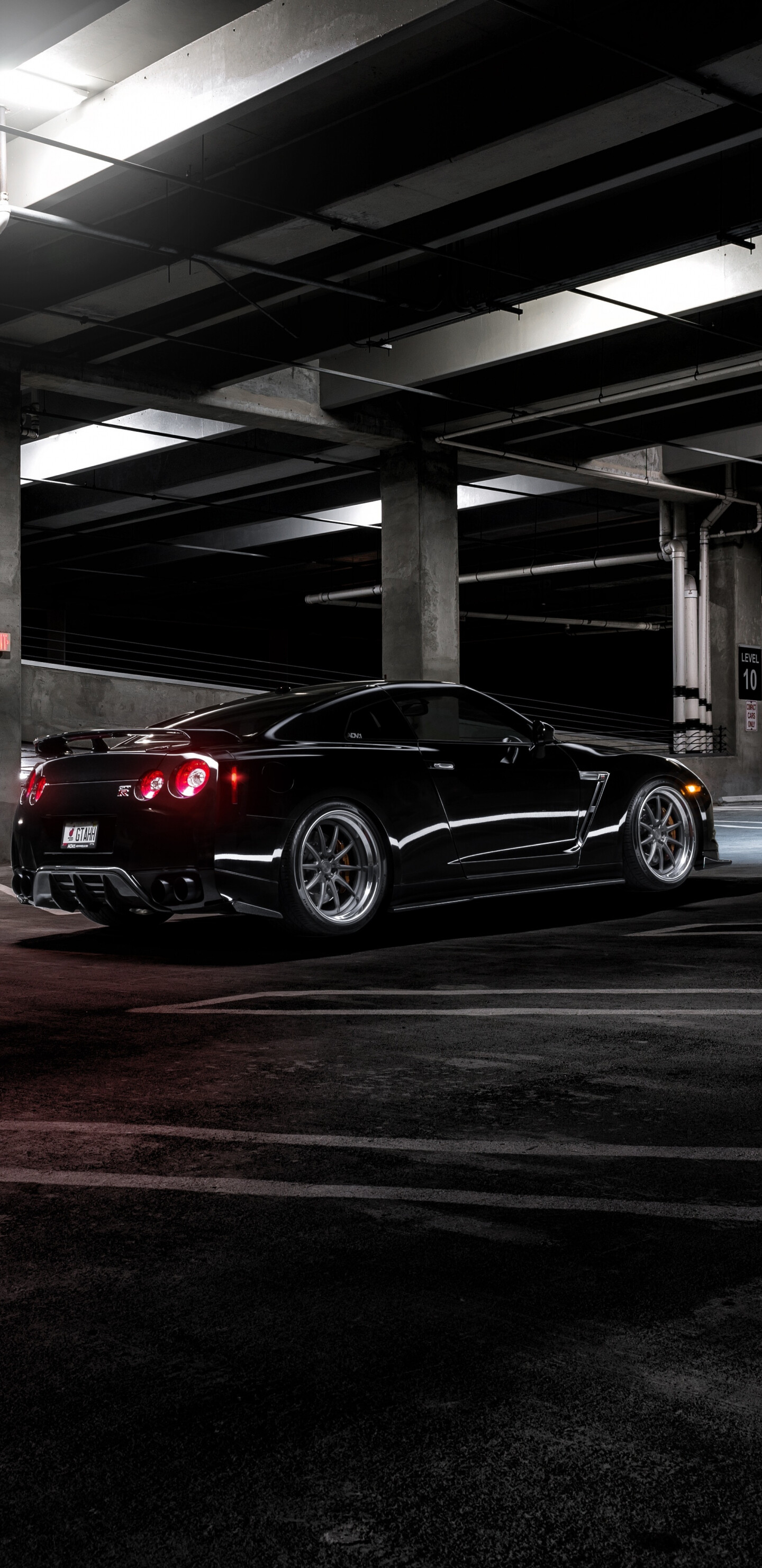 Black Nissan GT-R wallpaper, Bold and stealthy, Powerful presence, Make a statement, 1440x2960 HD Phone