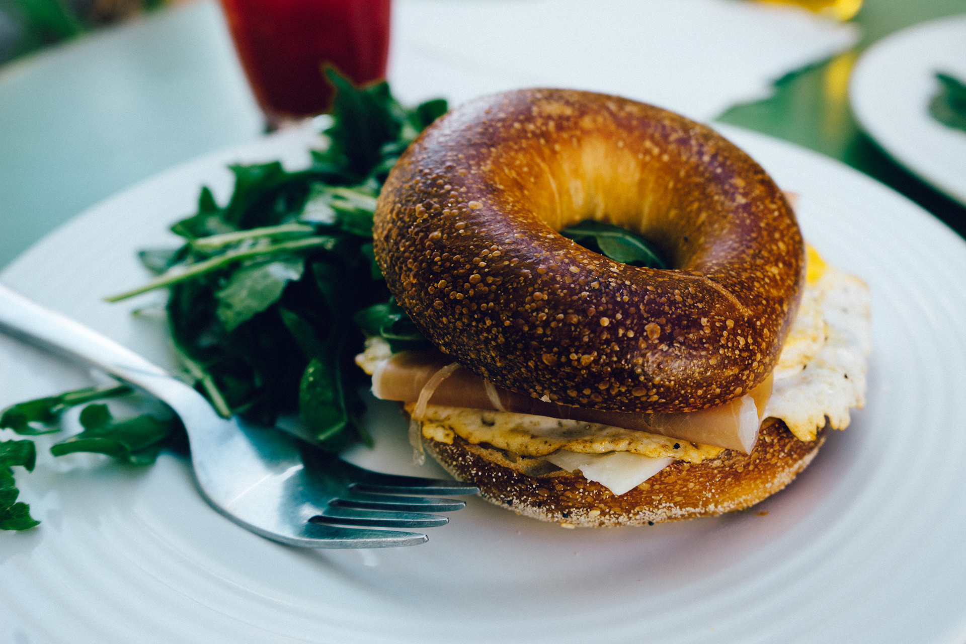 Bagel close-up, Appetizing sight, Enjoyable eating, Cutlery in frame, 1920x1280 HD Desktop