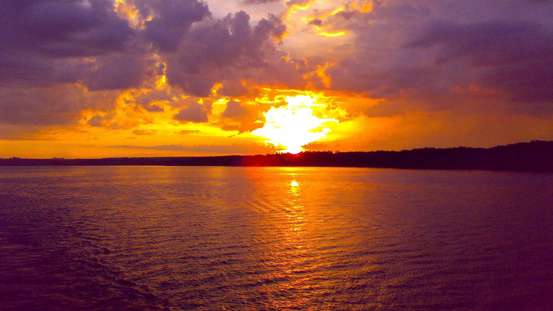 Blazing sunset horizon, Sunlight reflection on water, Purple evening sky clouds, Full HD Desktop wallpaper