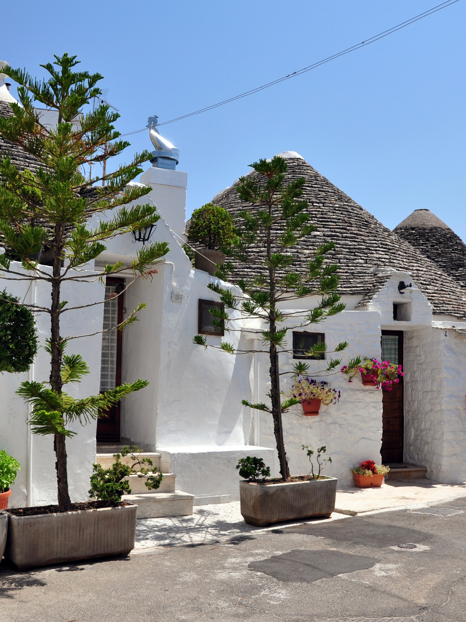 Italy's hidden gem, Quaint trulli houses, Vibrant city streets, 1540x2050 HD Phone