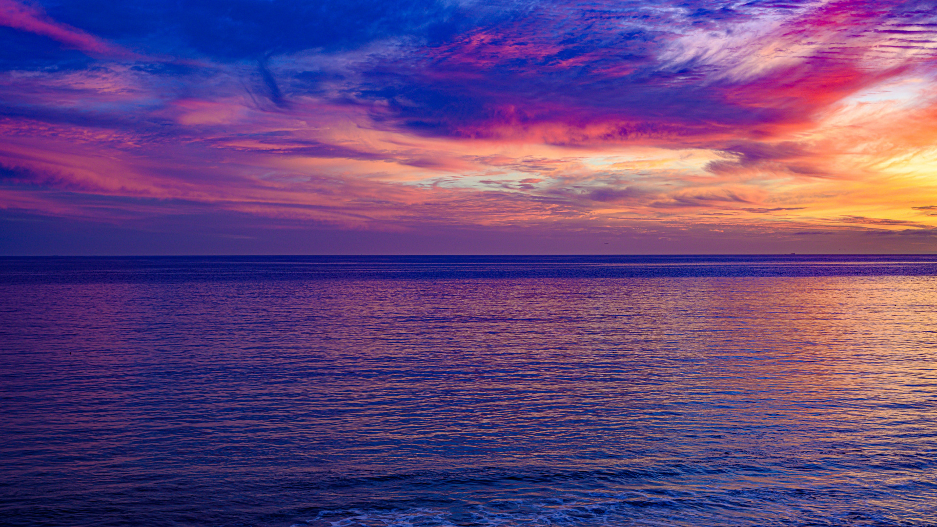vibrant magenta sunset sky, calm ocean horizon, purple rippling sea surface, Full HD Desktop wallpaper