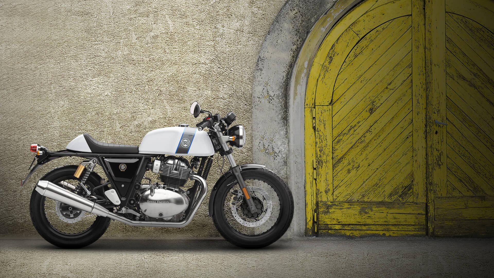 Royal Enfield Continental GT 650, Yellow arched wooden door, Textured stone wall, Full HD Desktop wallpaper