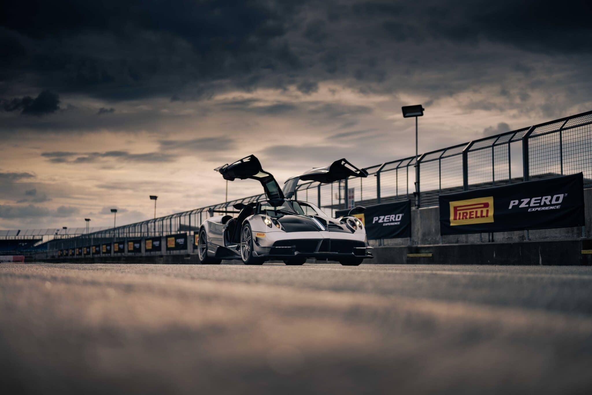 Pagani Huayra BC, Pirelli PZERO Experience banner, race track pit lane, HD Desktop wallpaper