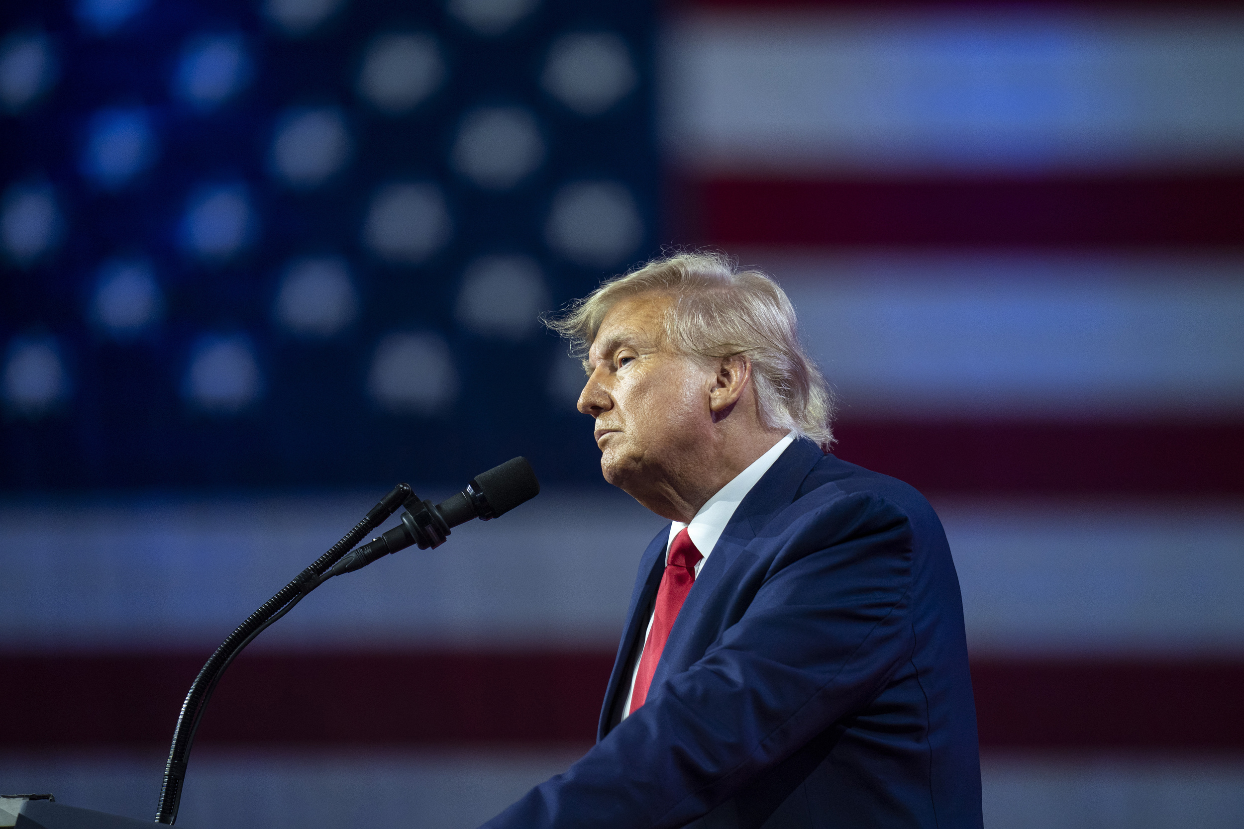 Donald Trump, American flag backdrop, podium microphone, HD Desktop wallpaper