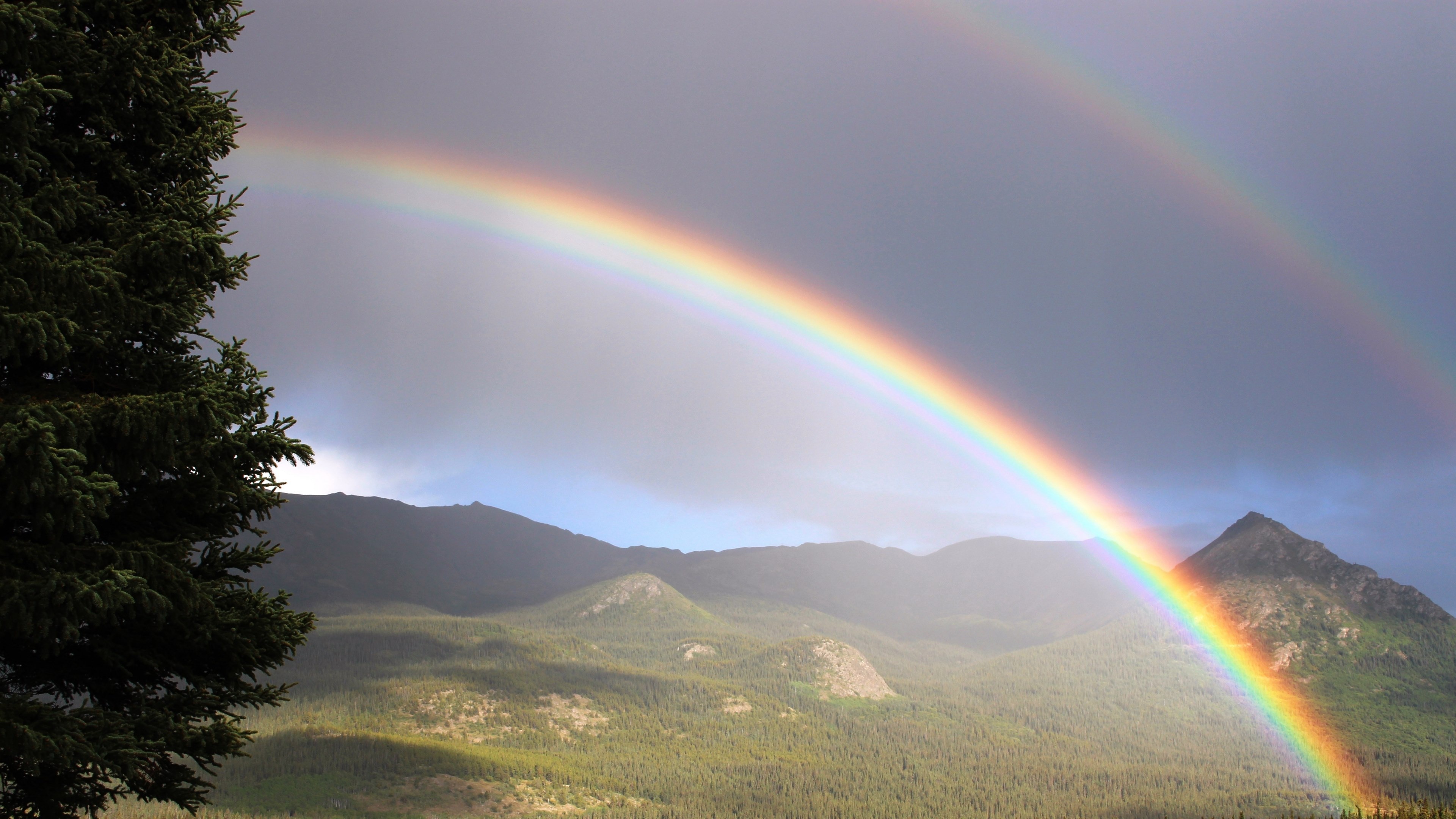 Double rainbow over mountains, Forested mountain valley, Dark rainstorm sky, 4K Desktop wallpaper