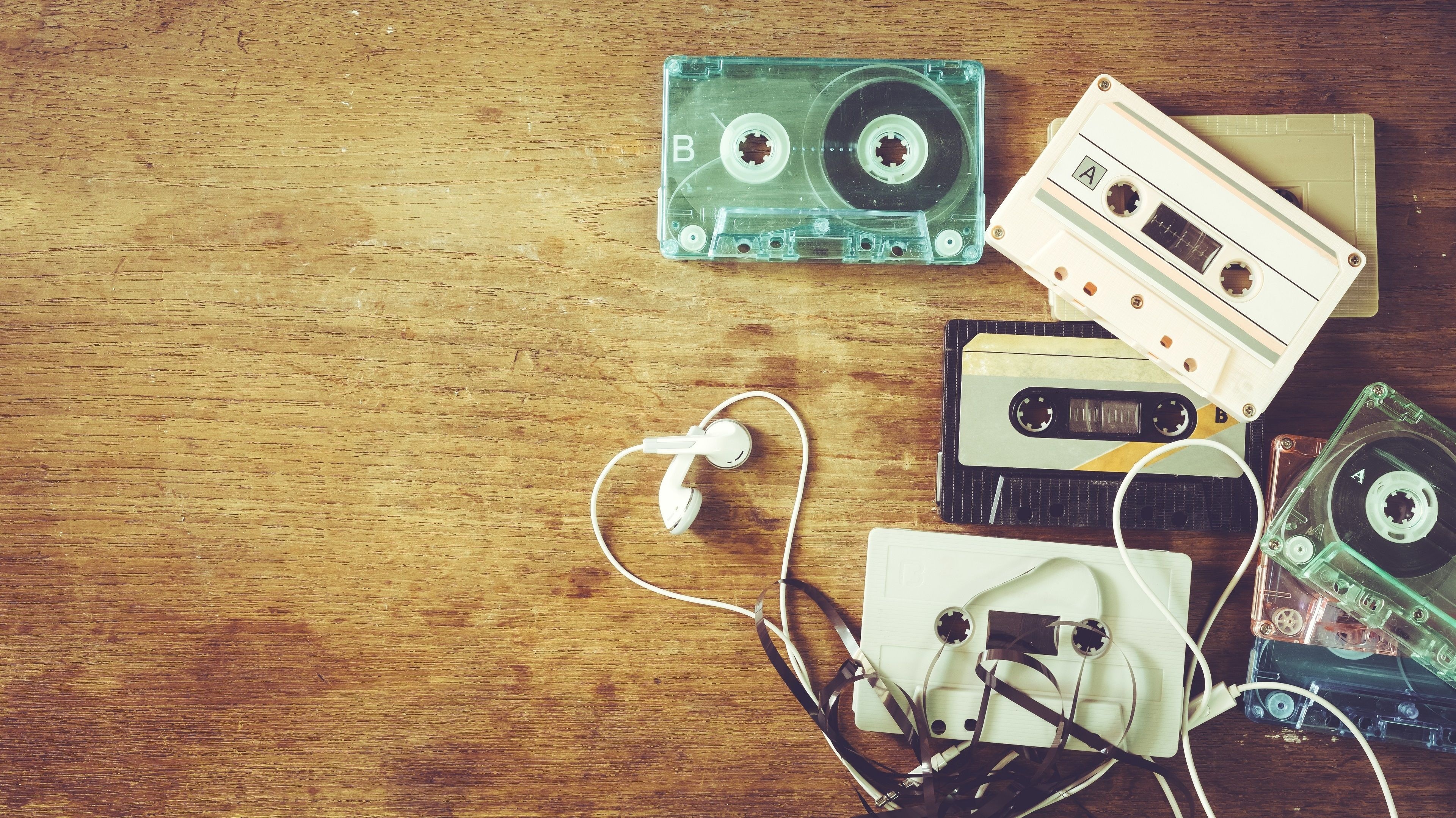 Vintage audio cassette tapes, Unspooled magnetic tape, White wired earphones, 4K Desktop wallpaper