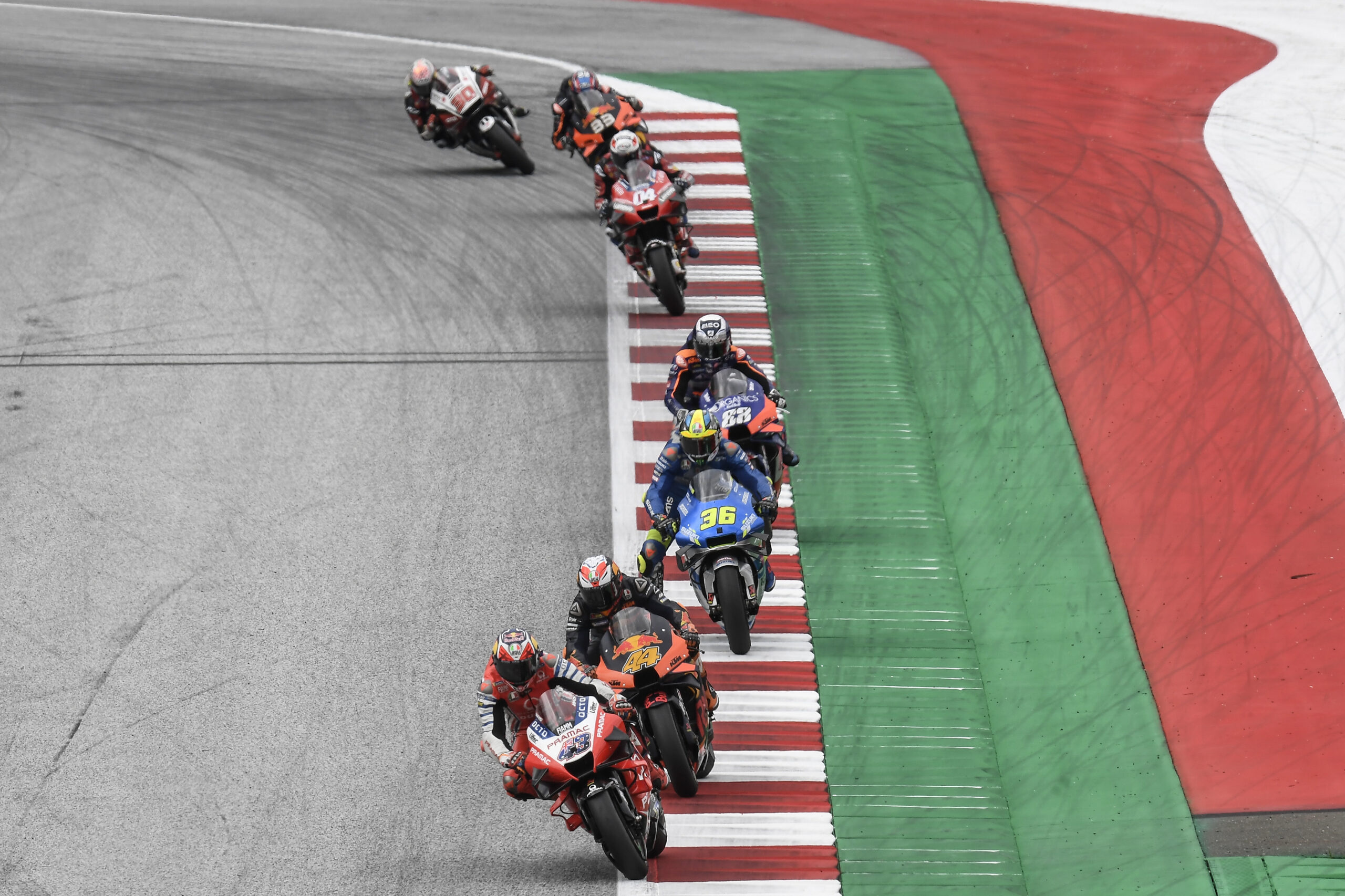 Pol Espargaro number 44, Pramac Ducati Desmosedici GP, Joan Mir number 36, Red Bull Ring kerbs, MotoGP riders single file, HD Desktop wallpaper