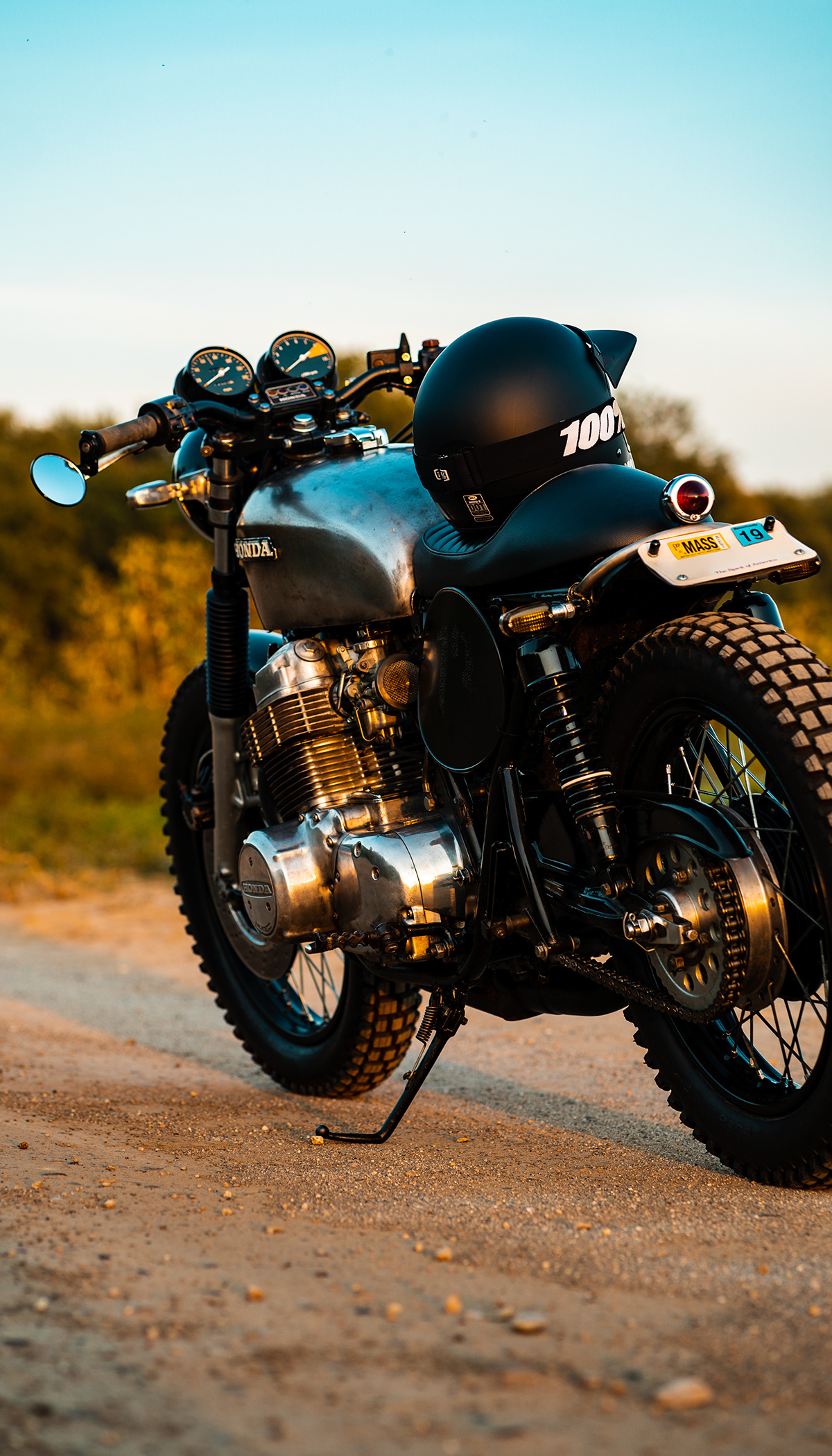 Honda CB750, Cafe racer in the dirt, Motorcycle versatility, Adventurous spirit, 1200x2100 HD Phone