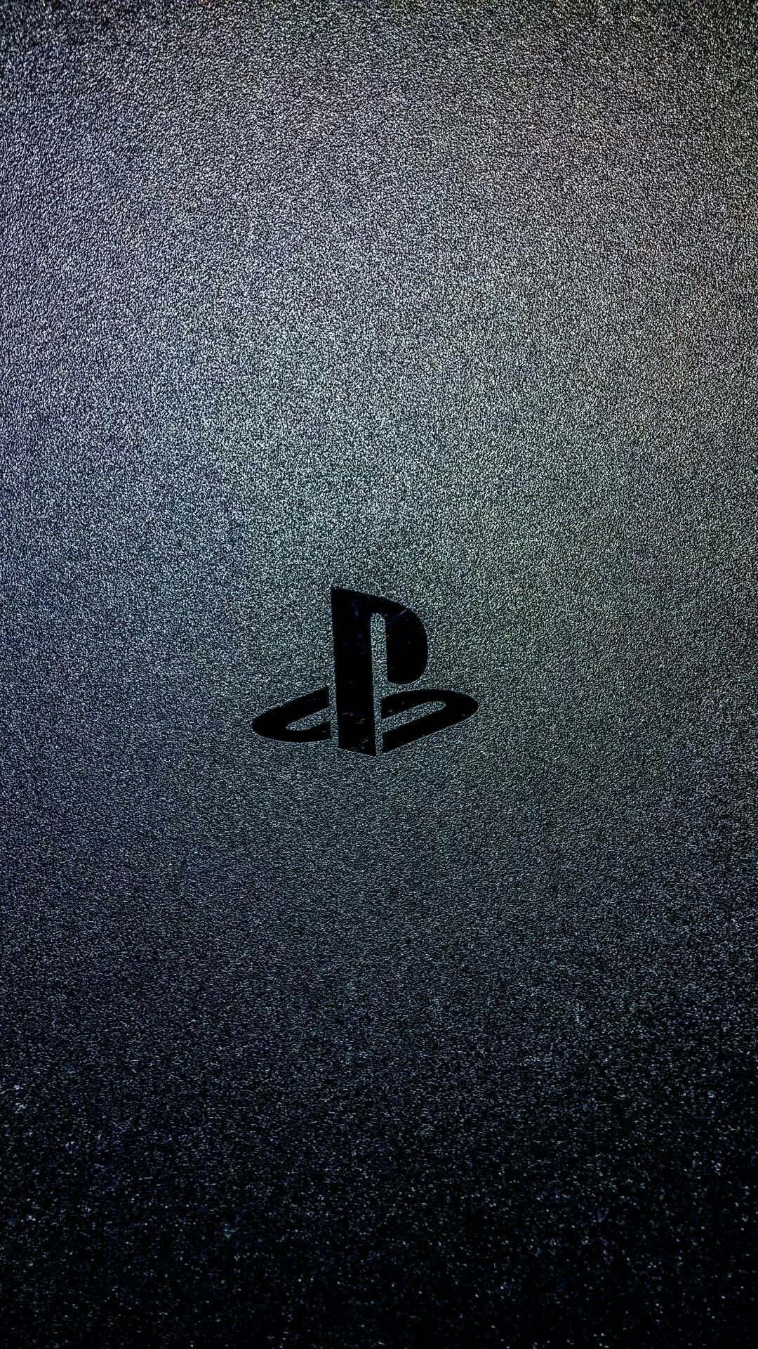 PlayStation console logo, Textured matte plastic surface, Dramatic overhead lighting, Full HD Phone wallpaper