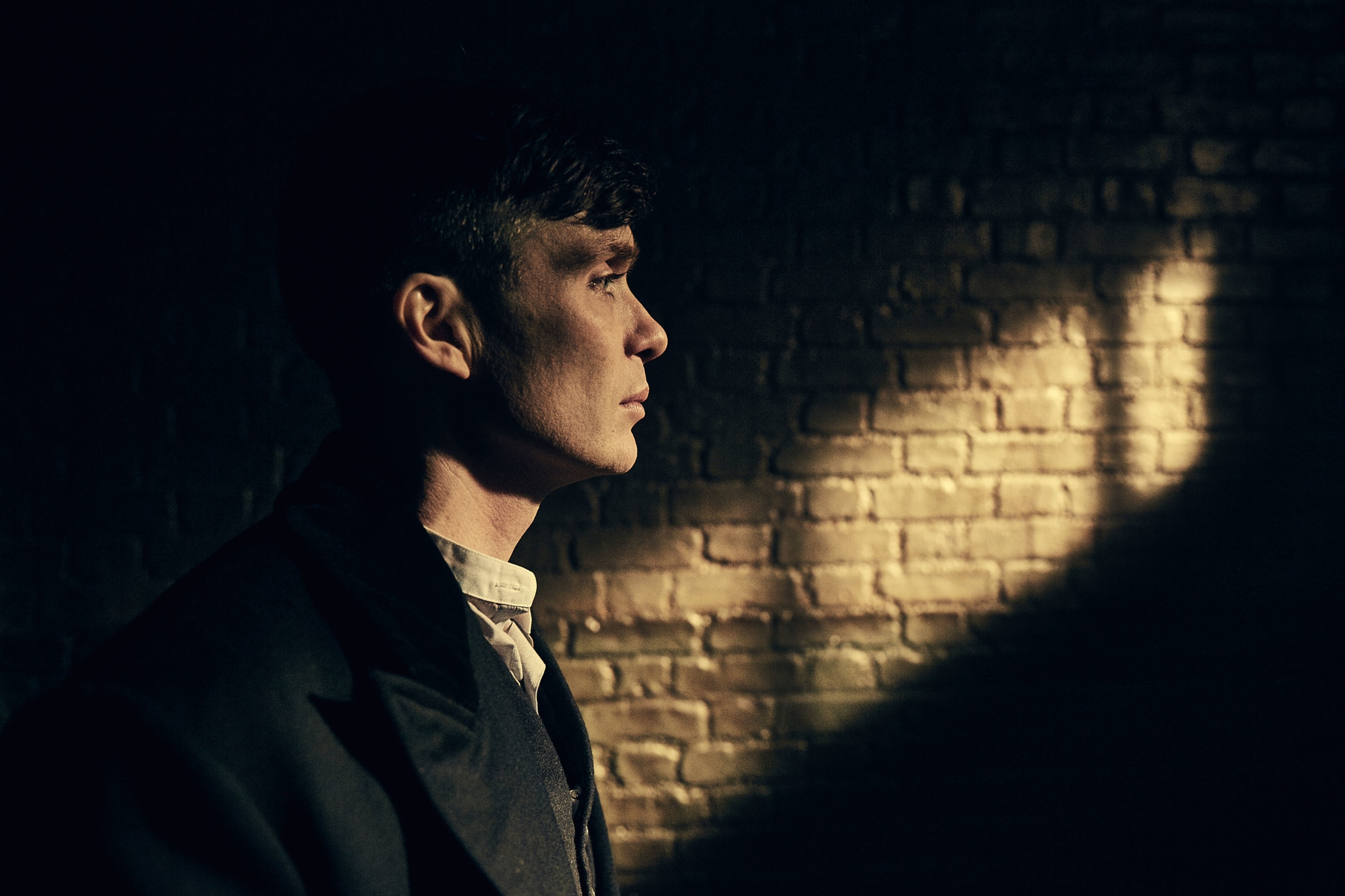 Tommy Shelby, Dimly lit interior, Shadowy brick wall, Birmingham, 4K Desktop wallpaper