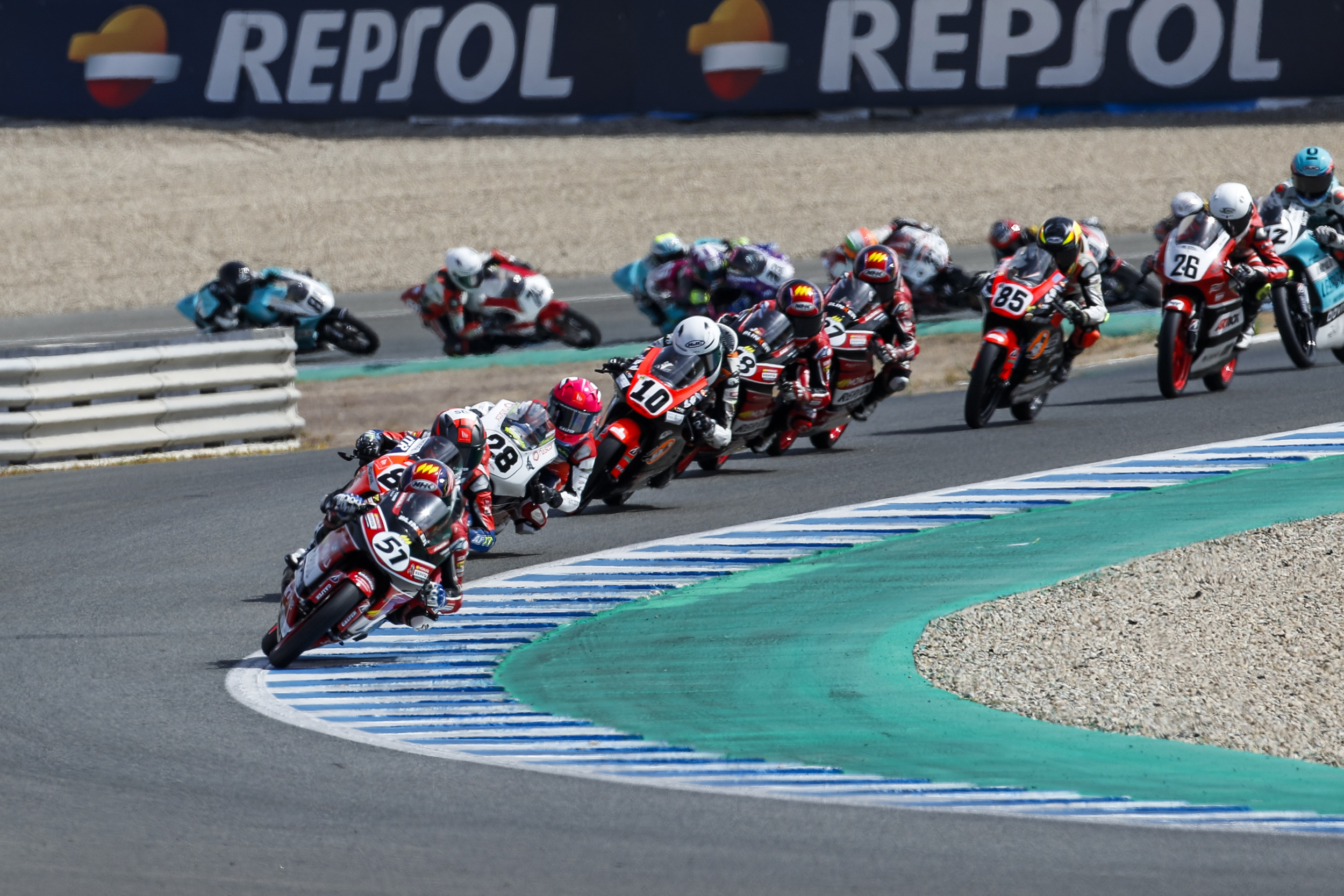 Moto3 field into corner, Junior racers in pack, Blue and green kerbs, HD Desktop wallpaper