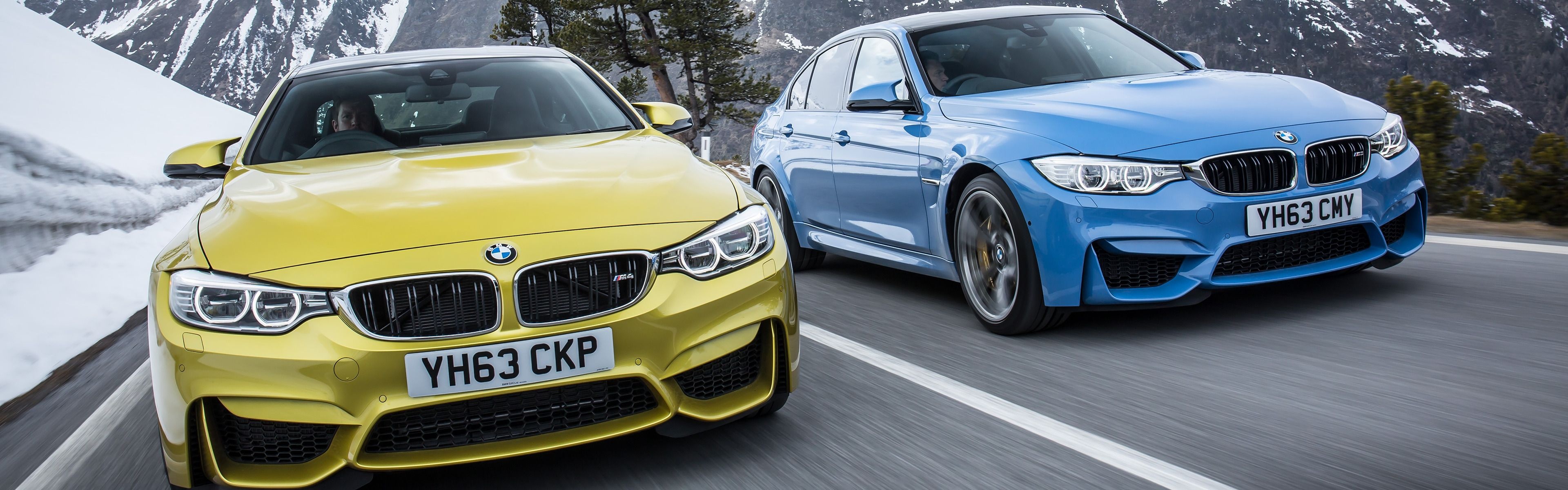 Austin Yellow BMW M4, Yas Marina Blue BMW M3, Snowy mountain pass road, Dual Screen Desktop wallpaper
