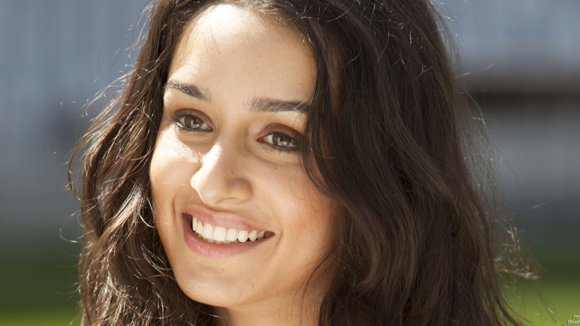 Shraddha Kapoor, smiling close-up portrait, sunlit outdoor lighting, Full HD Desktop wallpaper
