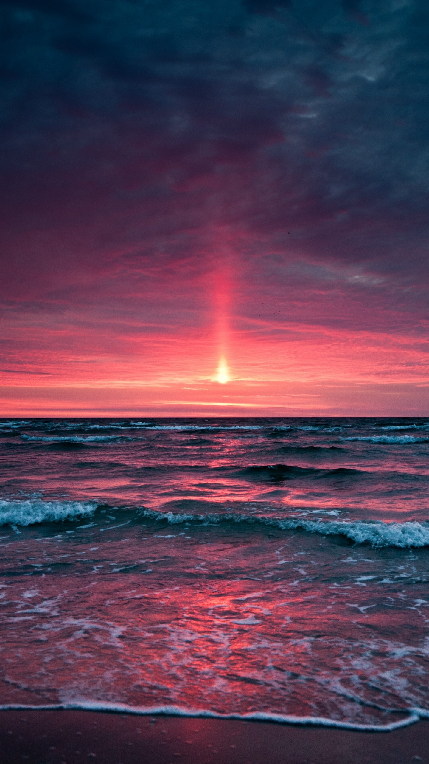 Vertical sun pillar, Crashing ocean waves, Magenta sunset clouds, HD Phone wallpaper
