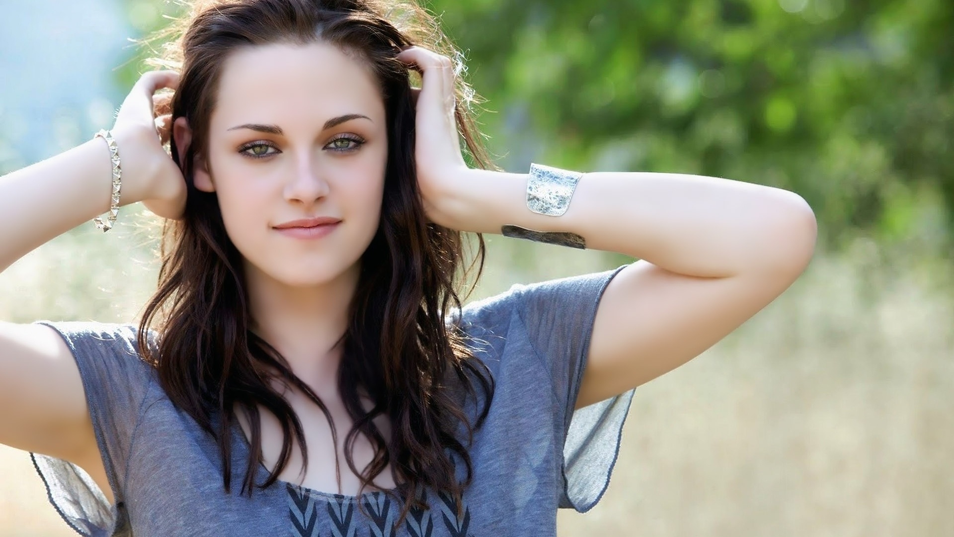 Kristen Stewart, silver cuff bracelet, blurred outdoor greenery, Full HD Desktop wallpaper
