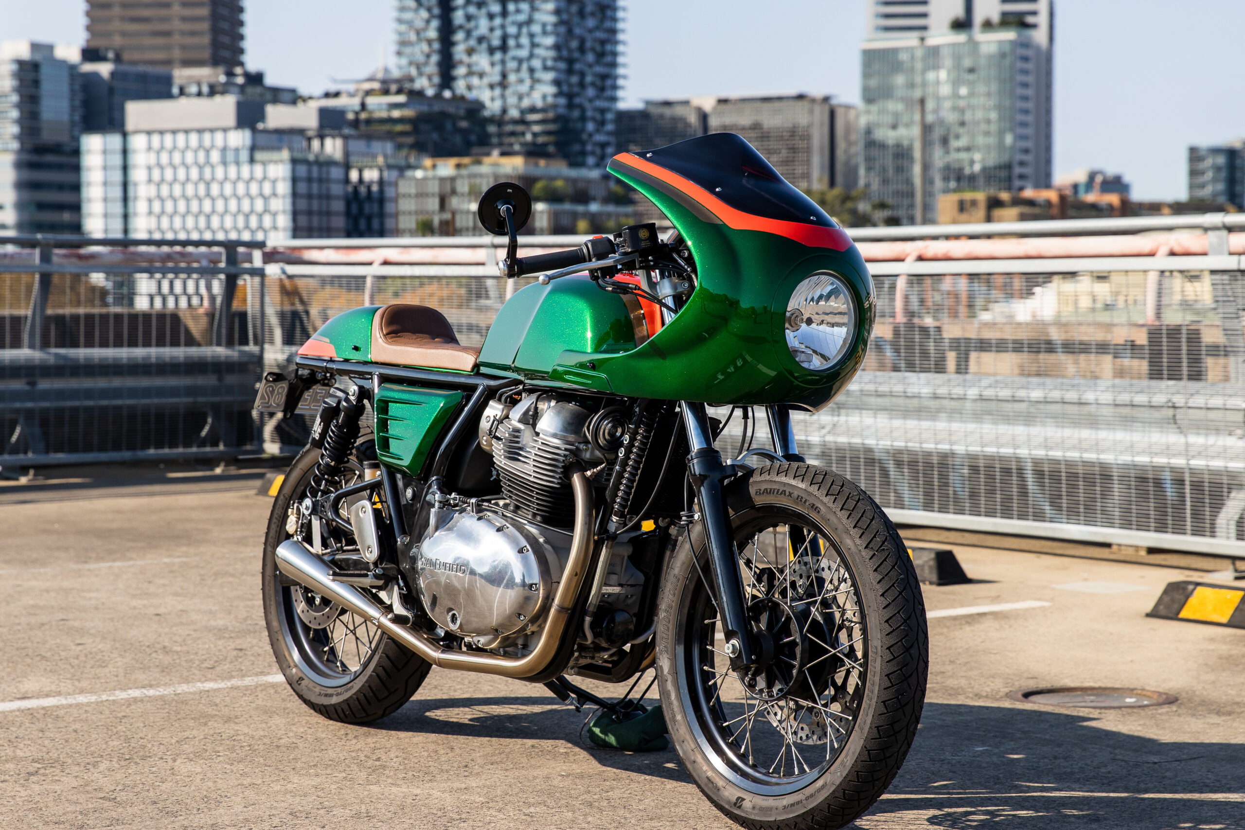 Custom Royal Enfield Continental GT 650, Retro green café fairing, Urban rooftop parking lot, HD Desktop wallpaper