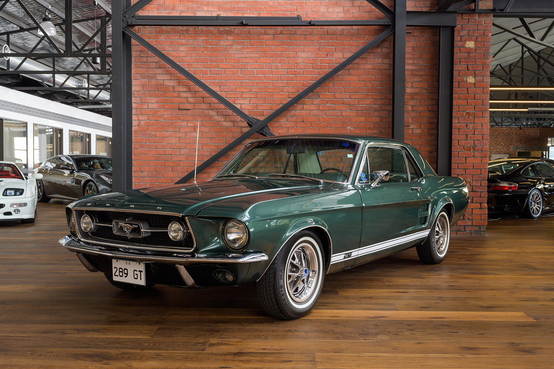 1967 Ford Mustang GT, Red brick showroom wall, Polished hardwood flooring, HD Desktop wallpaper
