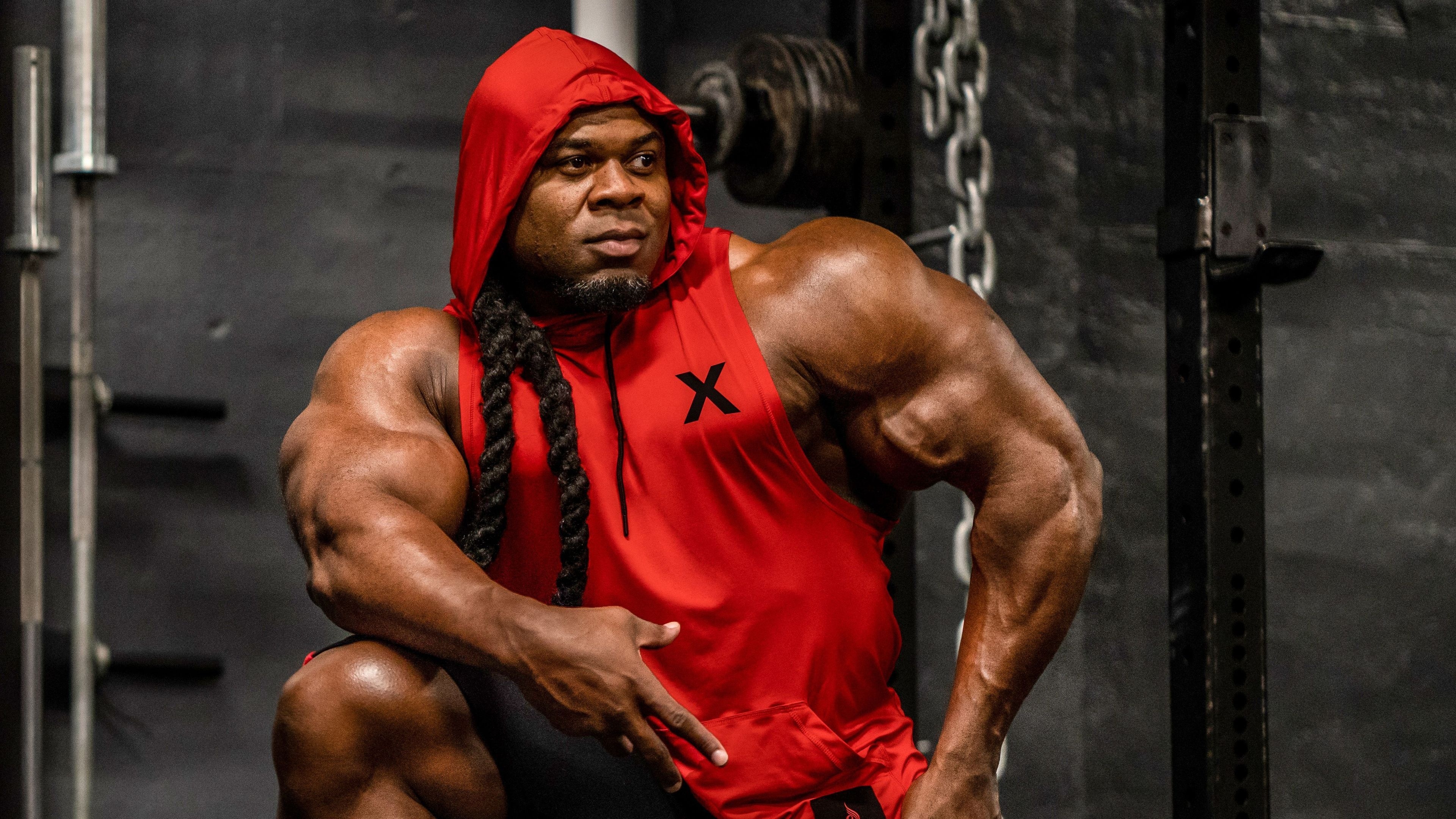 Kai Greene, Red hooded sleeveless shirt, Weightlifting chains and barbell, 4K Desktop wallpaper