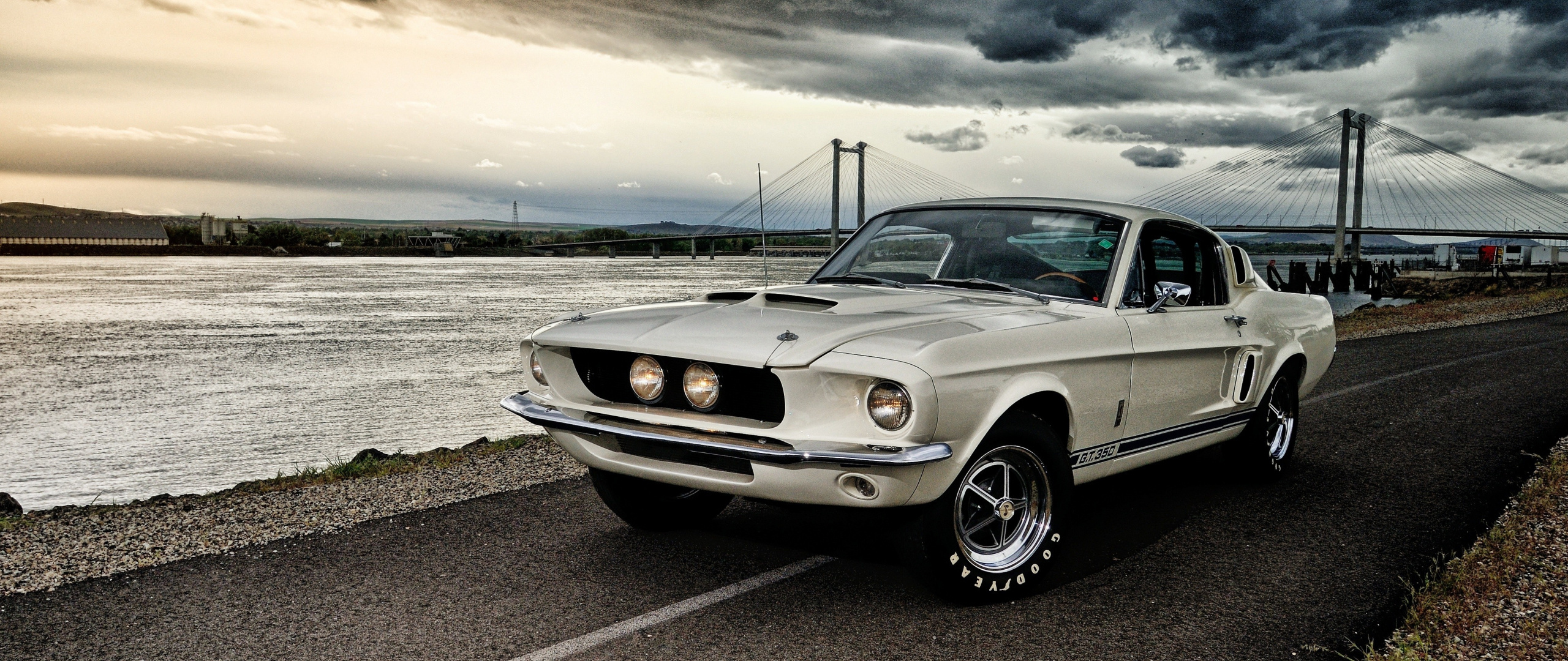 1967 Shelby GT350 Fastback, Cable-stayed bridge background, Overcast riverside road, Dual Screen Desktop wallpaper