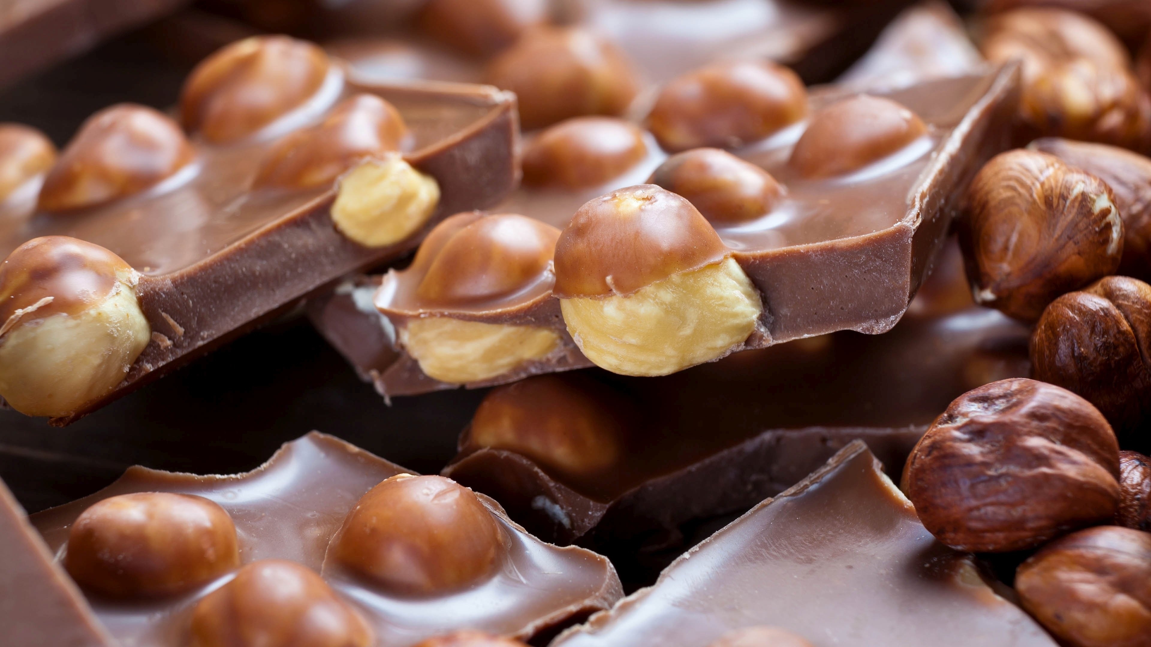 Milk chocolate, Irresistible hazelnuts, Decadent treat, Tempting wallpaper, 3840x2160 4K Desktop