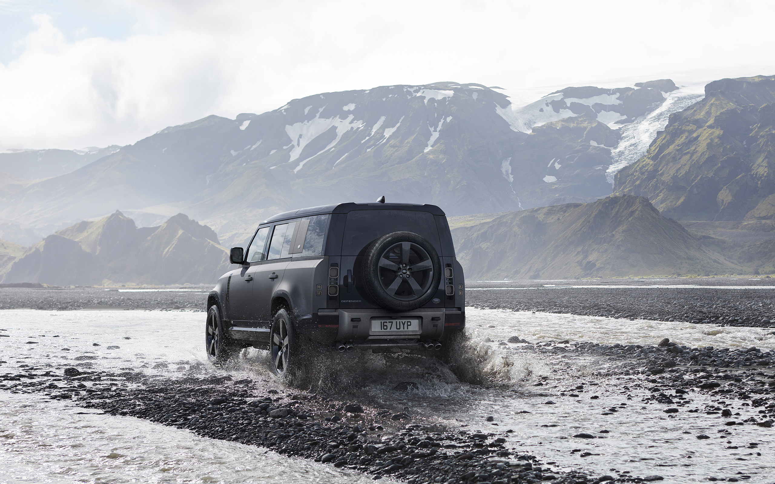 Land Rover Defender 2022, Rear view, Off-road driving, Sleek black design, 2560x1600 HD Desktop