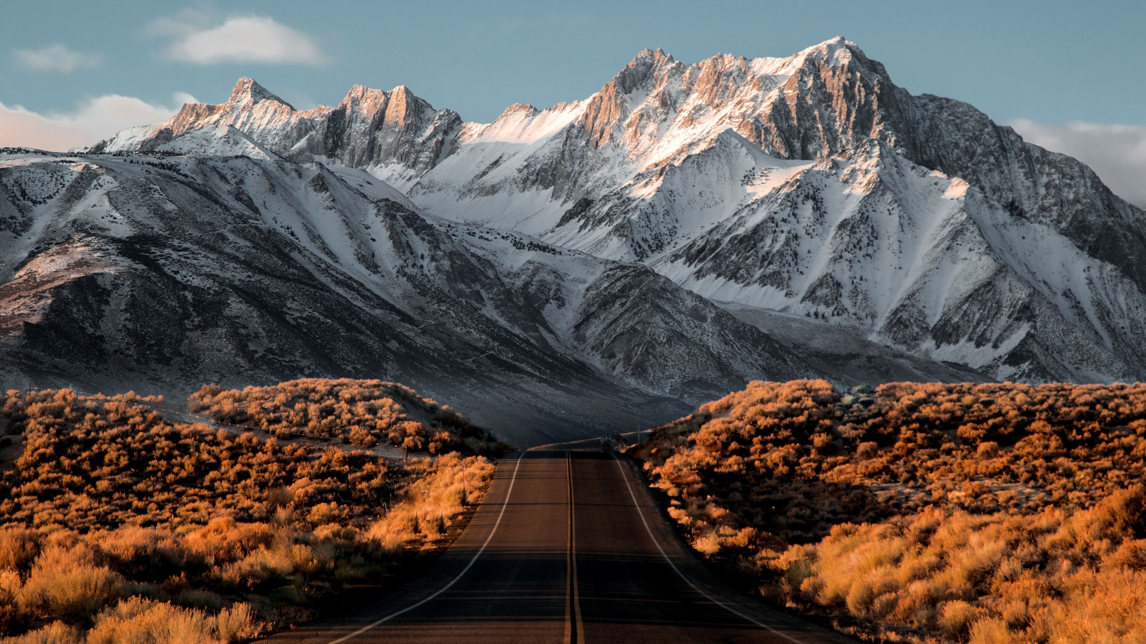 Sierra Nevada mountains, straight asphalt highway, golden desert sagebrush, 4K Desktop wallpaper
